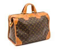A Louis Vuitton Monogram Canvas Travel Bag, 16" x 13" x 9".
