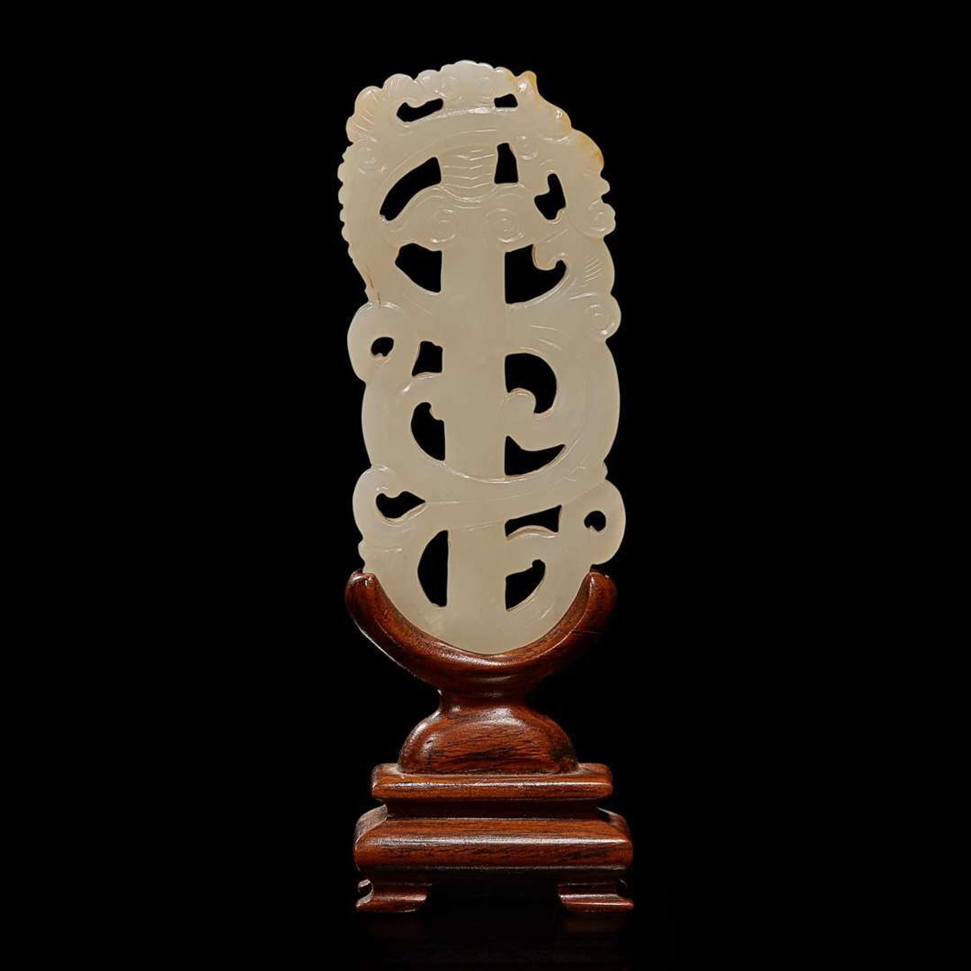 A Chinese white jade "sword" pendant and wood stand 劍形玉飾