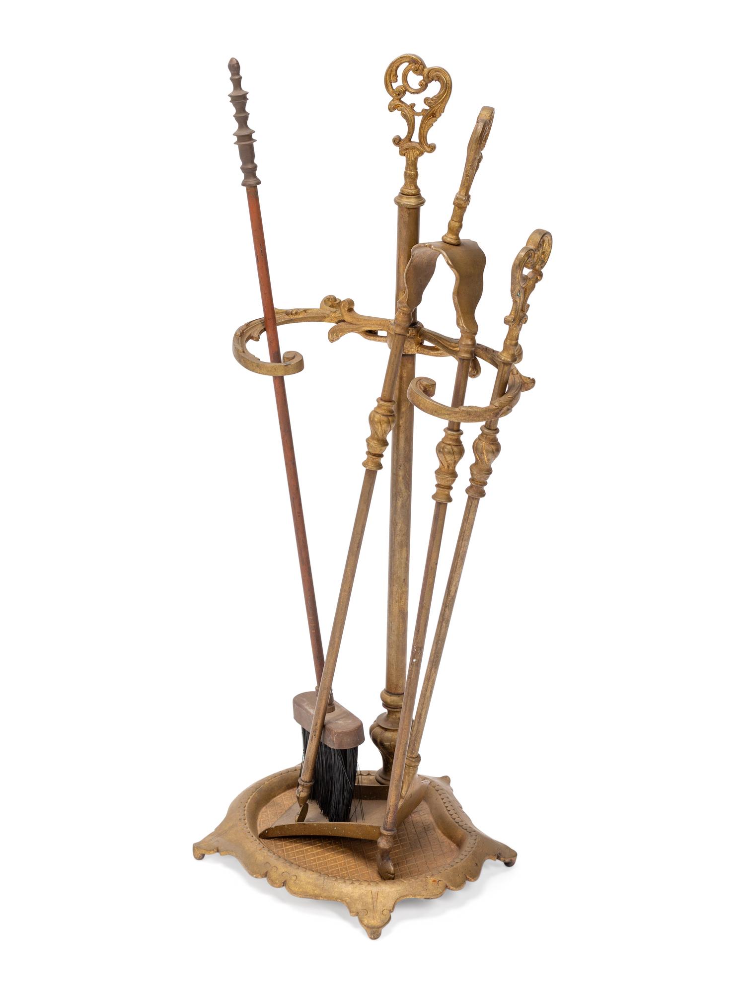 A Louis XV Style Gilt Bronze Four-Piece Fireplace Set
