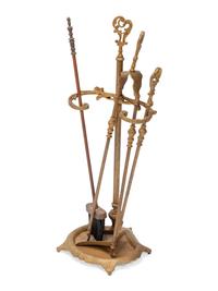 A Louis XV Style Gilt Bronze Four-Piece Fireplace Set