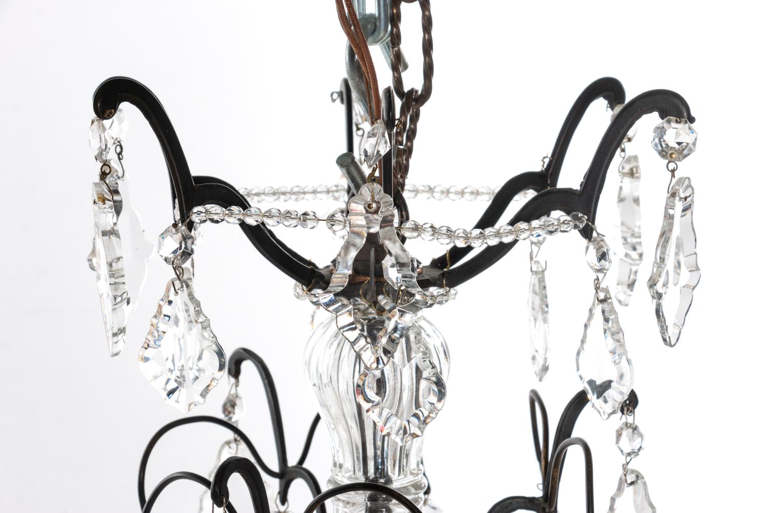 A French Bronze and Cut Glass Eight-Light Chandelier