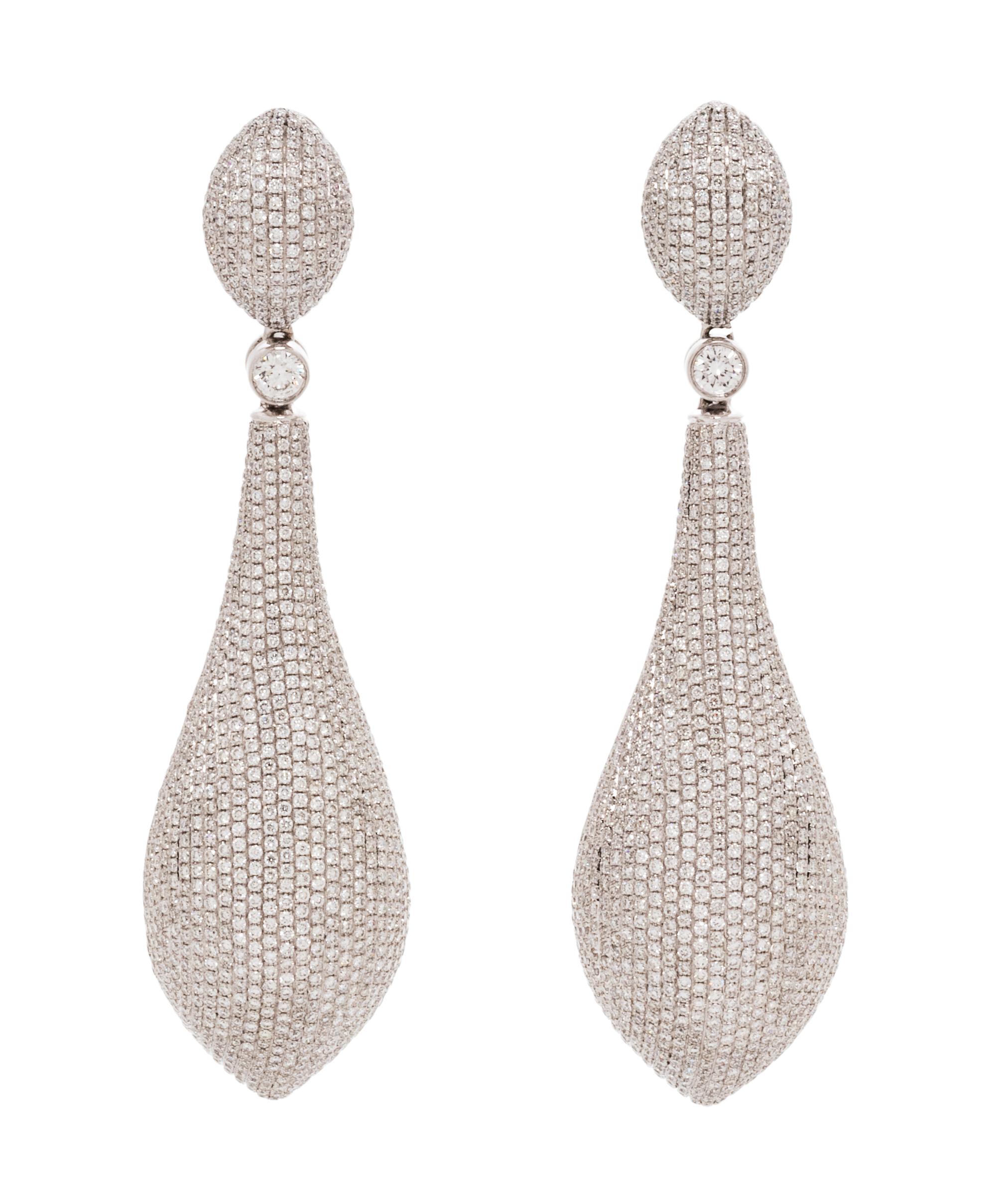 A Pair of 18 Karat White Gold and Diamond Earclips, 23.10 dwts.