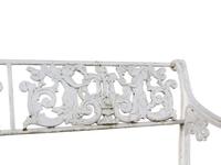 A White Painted Iron Garden Bench and a Pair of Torchères