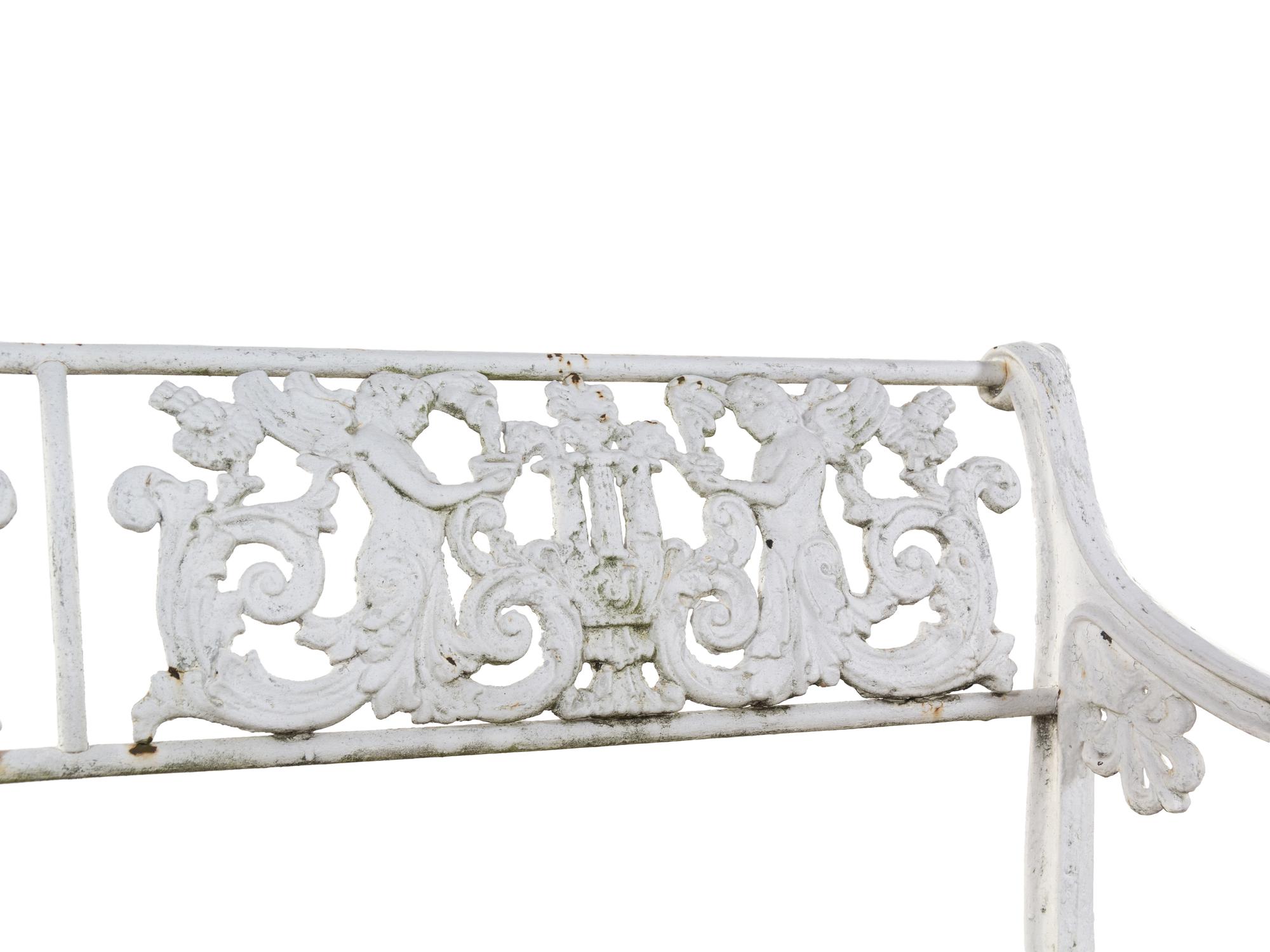 A White Painted Iron Garden Bench and a Pair of Torchères