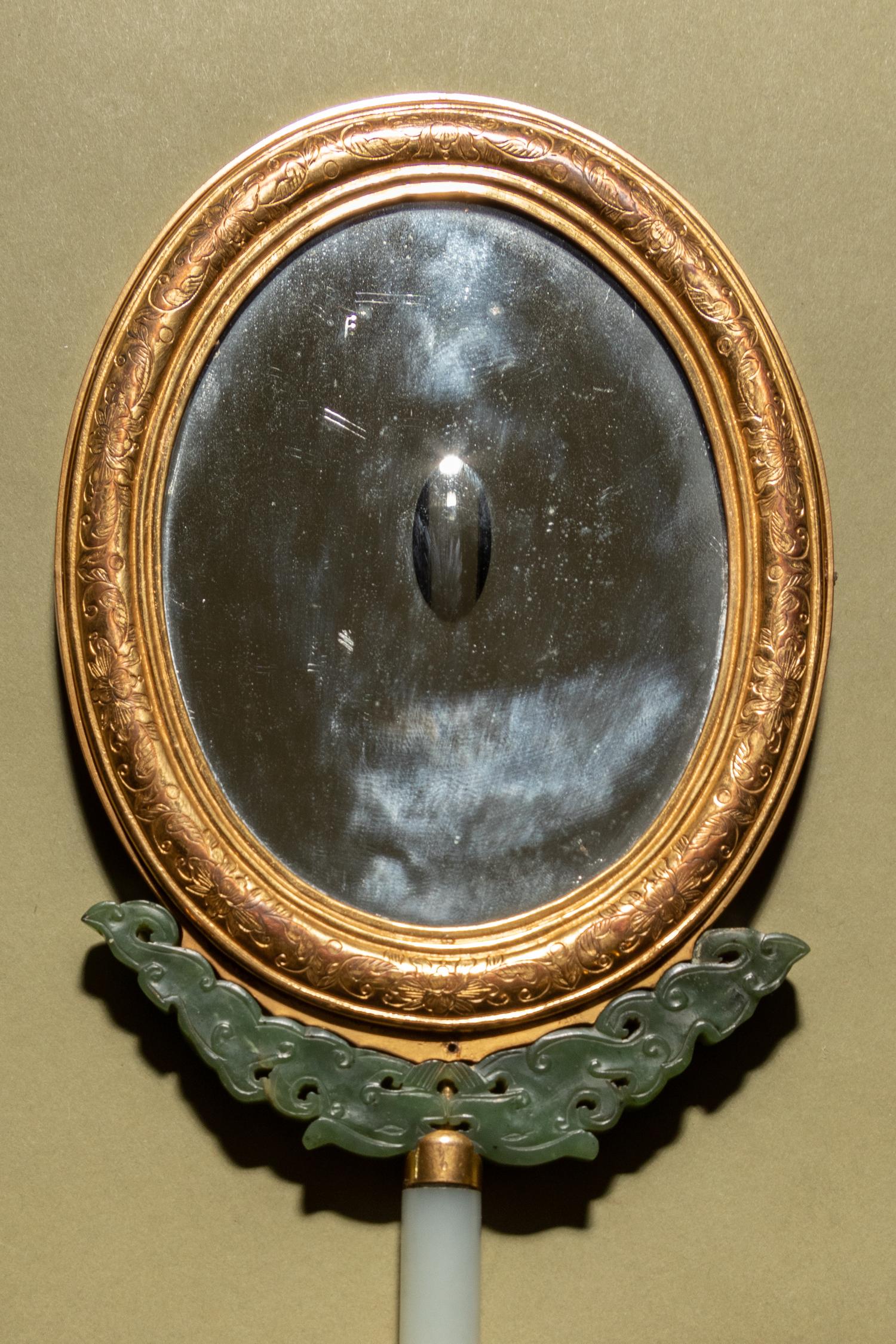 A Painted Enamel and Hardstone Mounted Gilt Metal Hand Mirror