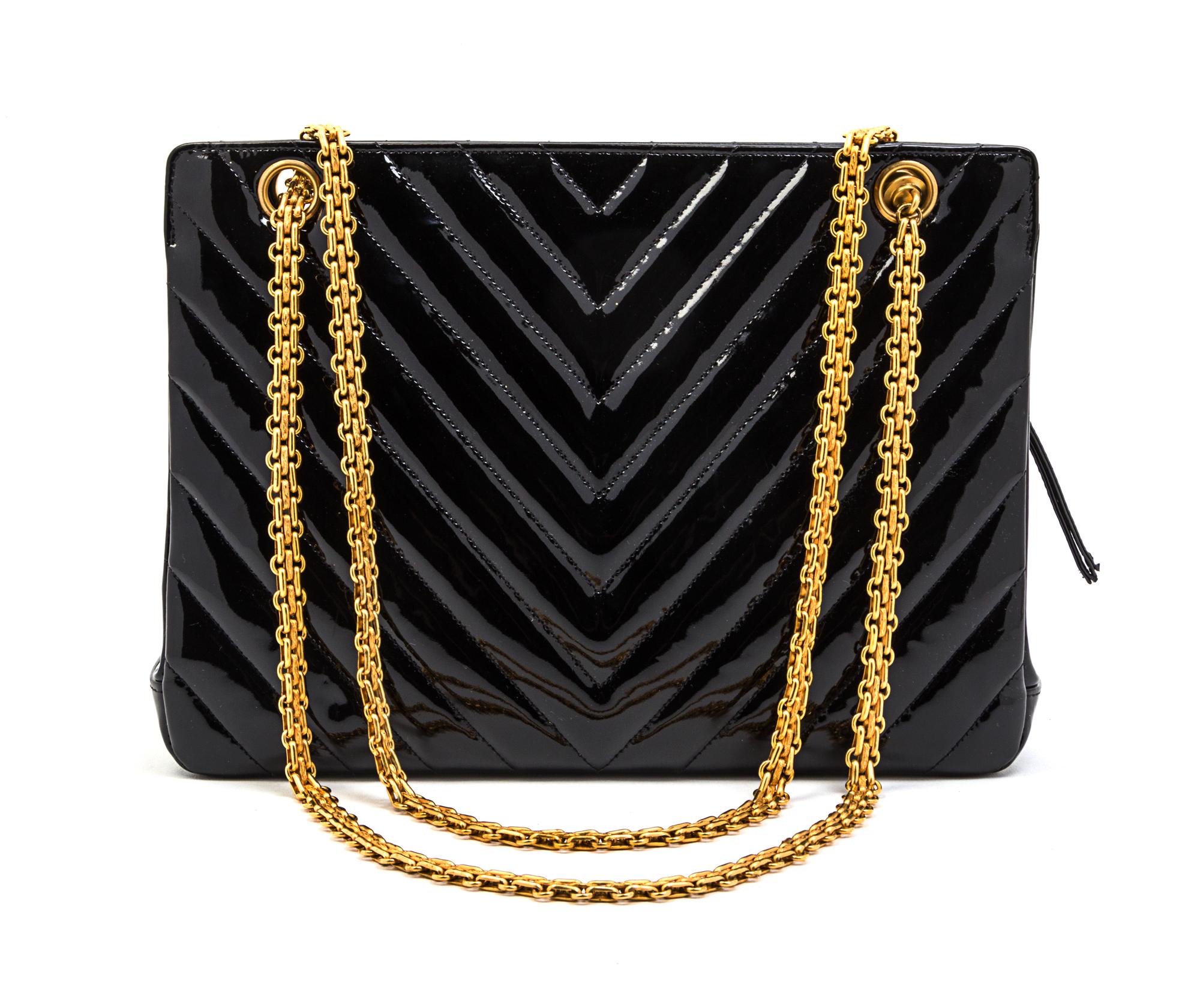 A Chanel Black Patent Leather Chevron Quilted Bag, 11 x 8 x 3 inches.