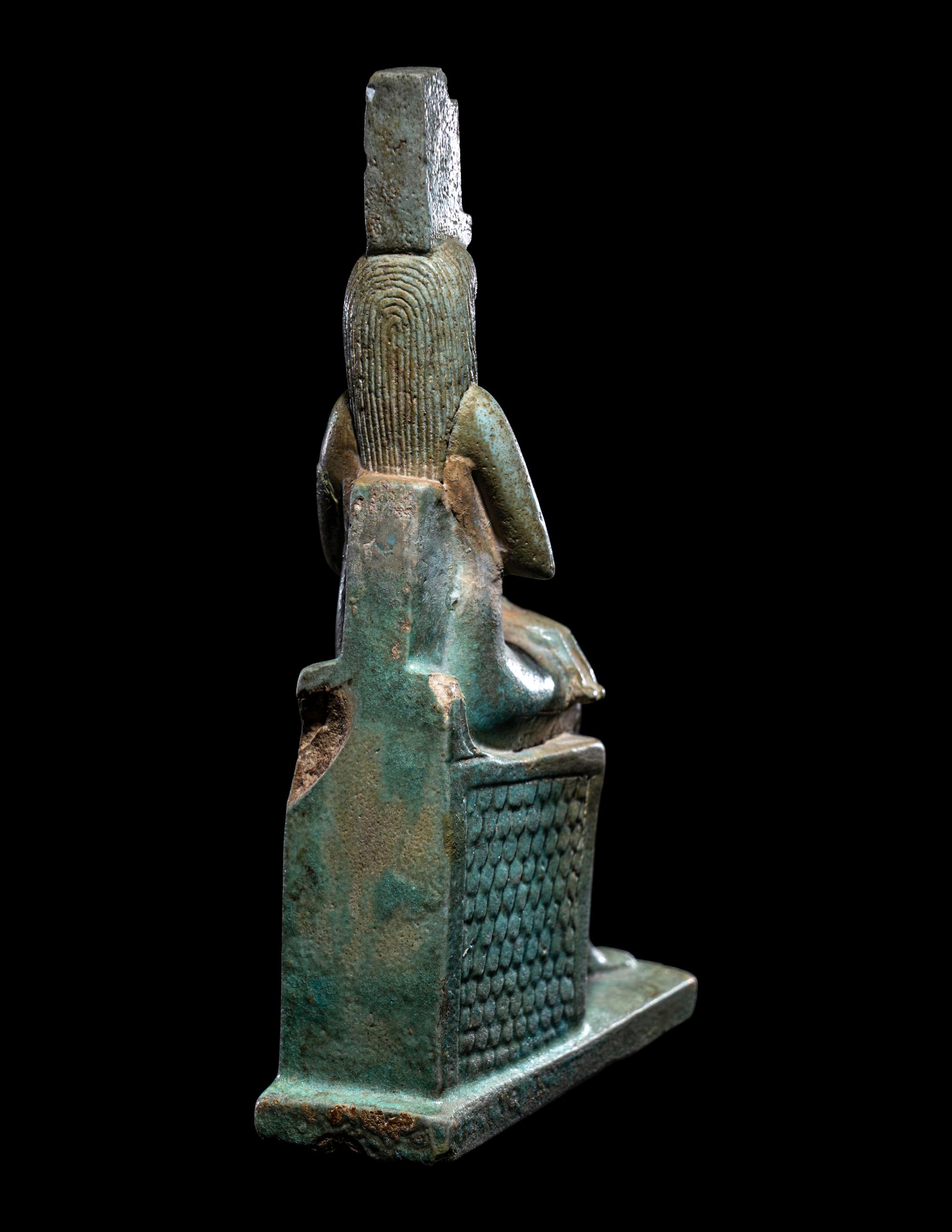 An Egyptian Faience Isis Nursing Harpocrates