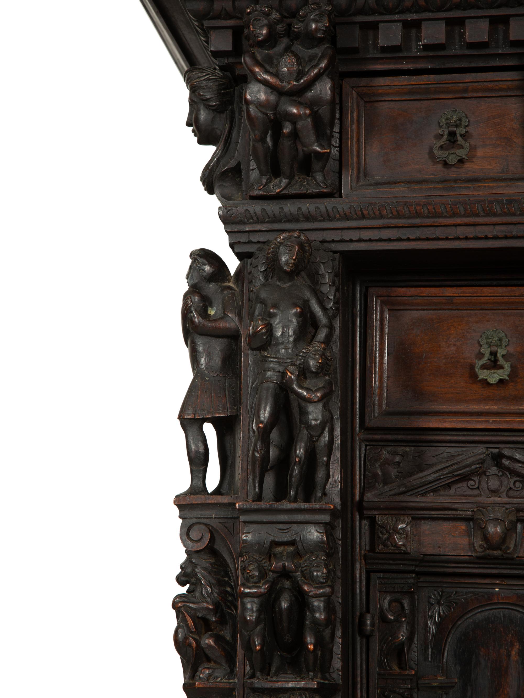 A Continental Baroque Walnut Cabinet