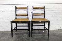A Pair of Ebonized and Painted Caned Chairs Height 32 inches. — EARLY 20TH CENTURY