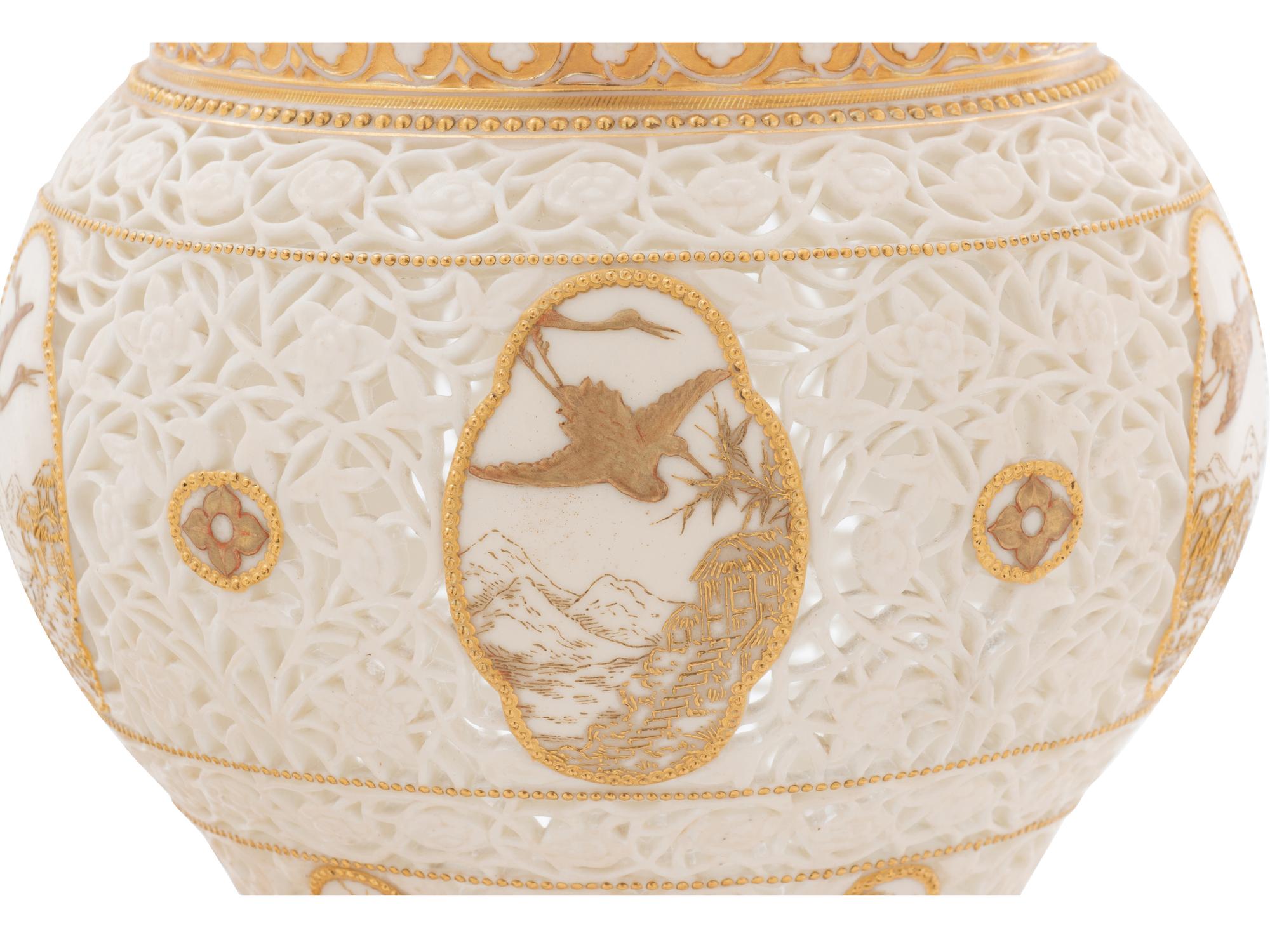 A Royal Worcester Parcel Gilt Reticulated Porcelain Vase and Cover