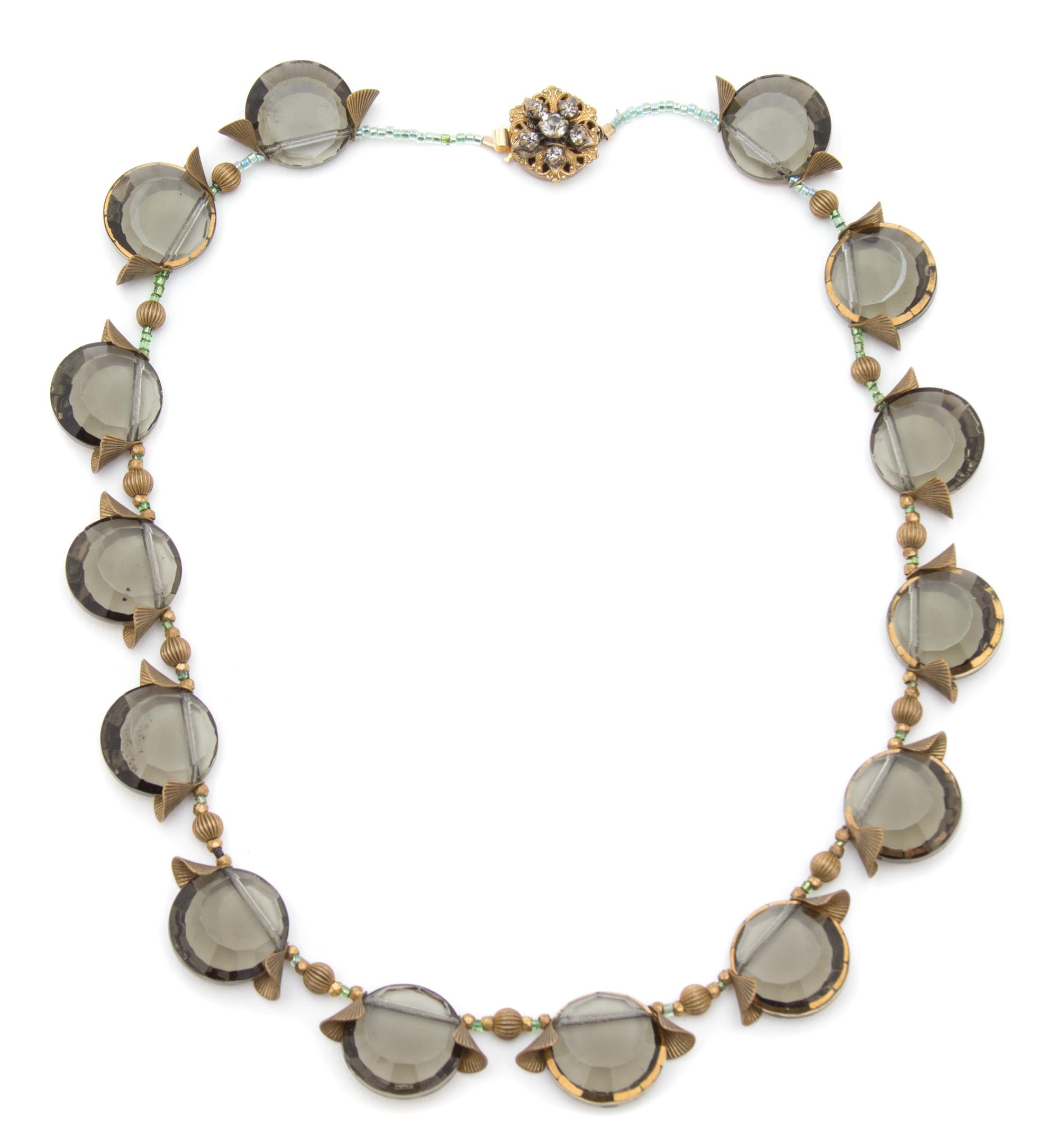 A Miriam Haskell Smoke Rhinestone Demi Parure, Necklace: 16"; Earclips: 1" diameter.