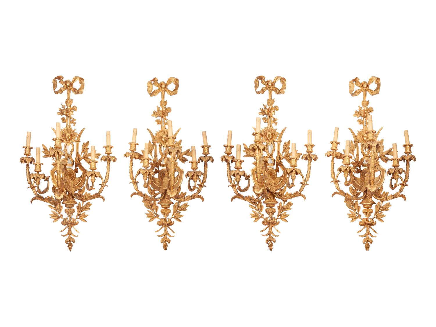 A Set of Four Louis XVI Style Gilt Bronze Five-Light Scones