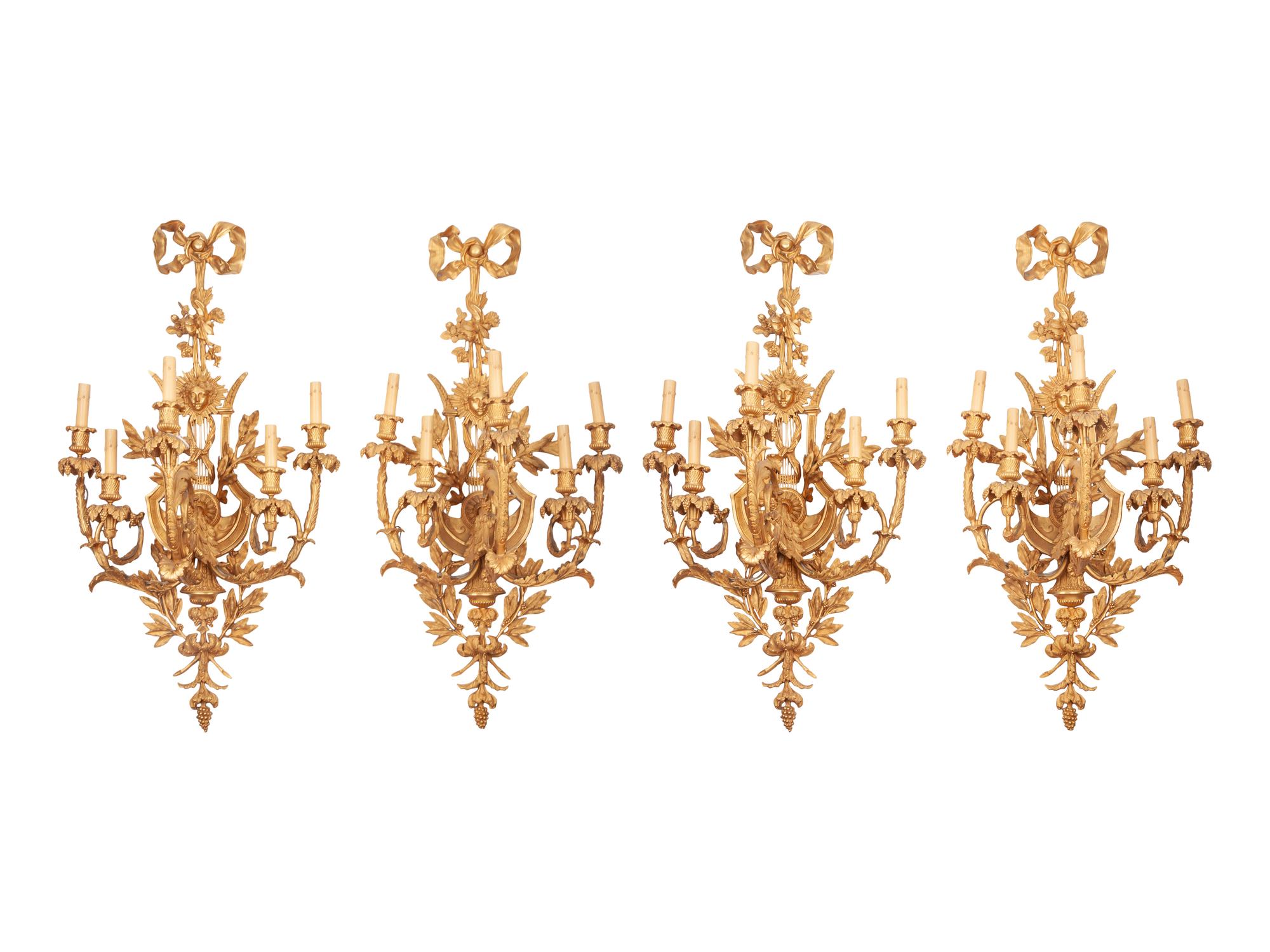 A Set of Four Louis XVI Style Gilt Bronze Five-Light Scones