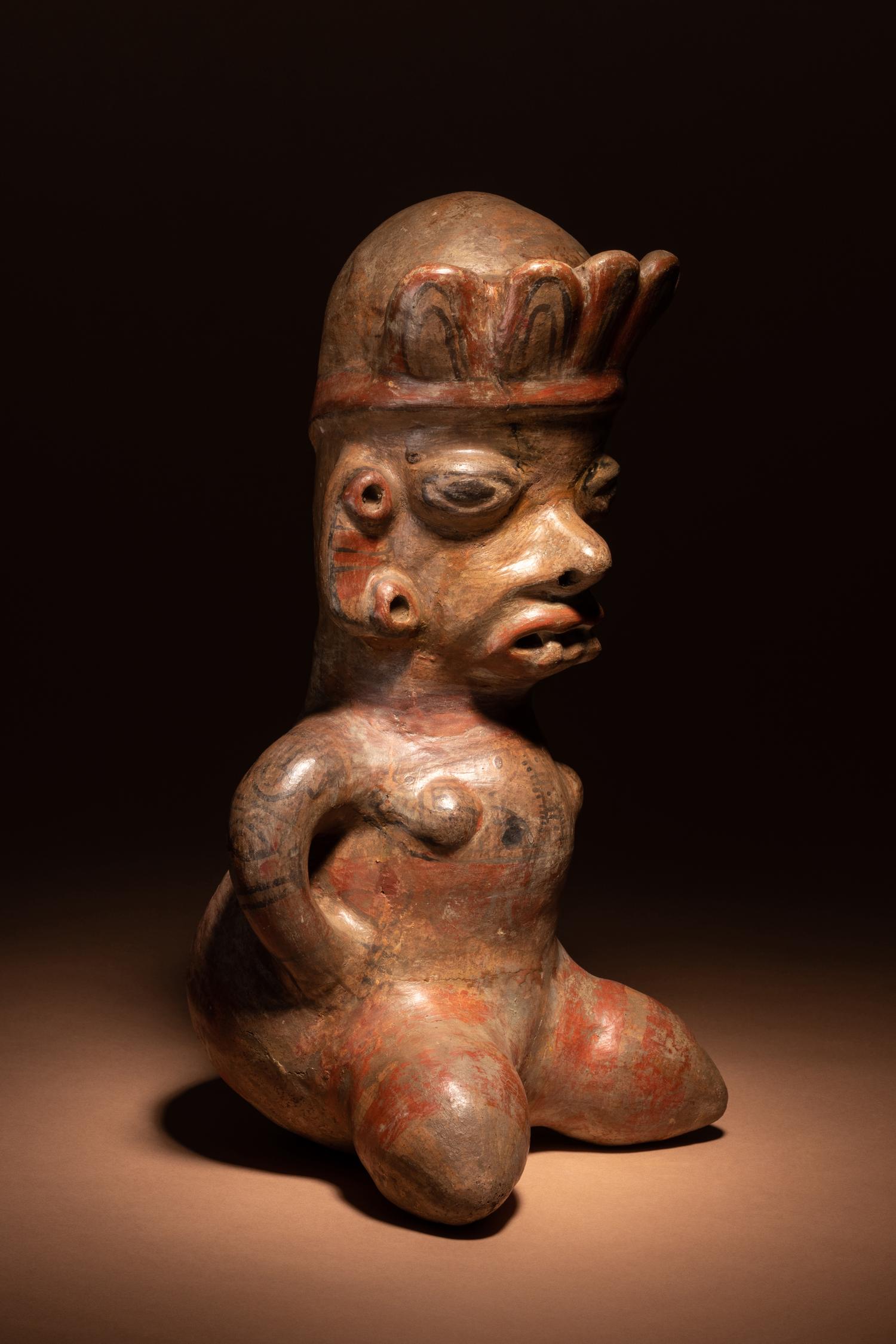 A Nicoya Polychrome Terracotta Seated Figure