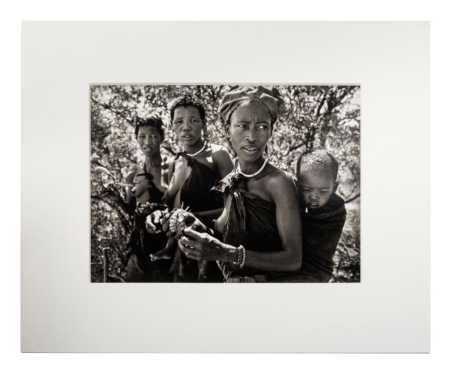 Sebastião Salgado (born 1944) Bushmen women collecting caterpillars in the Kalahari Desert. Botswana, Africa, 2008