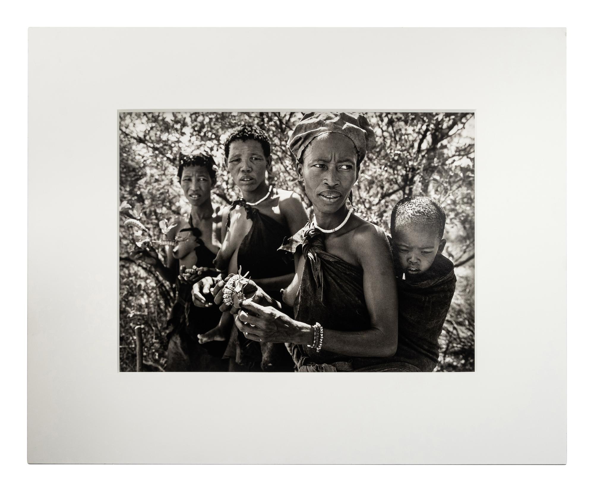 Sebastião Salgado (born 1944) Bushmen women collecting caterpillars in the Kalahari Desert. Botswana, Africa, 2008