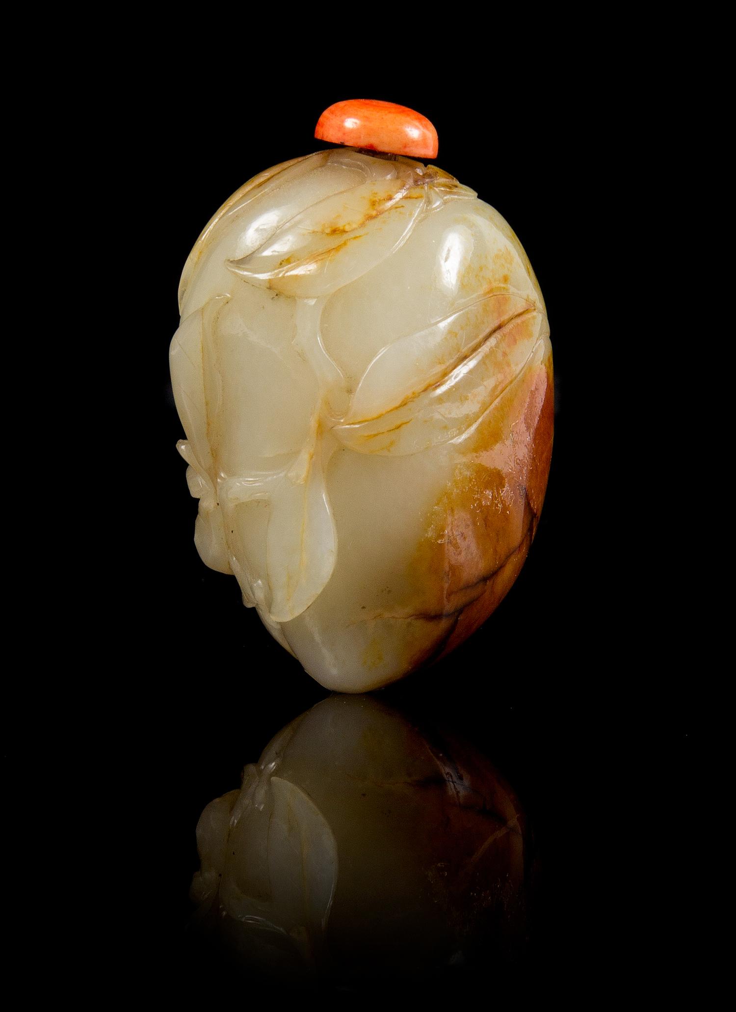 A Carved Jade Snuff Bottle Height 2 3/8 inches.