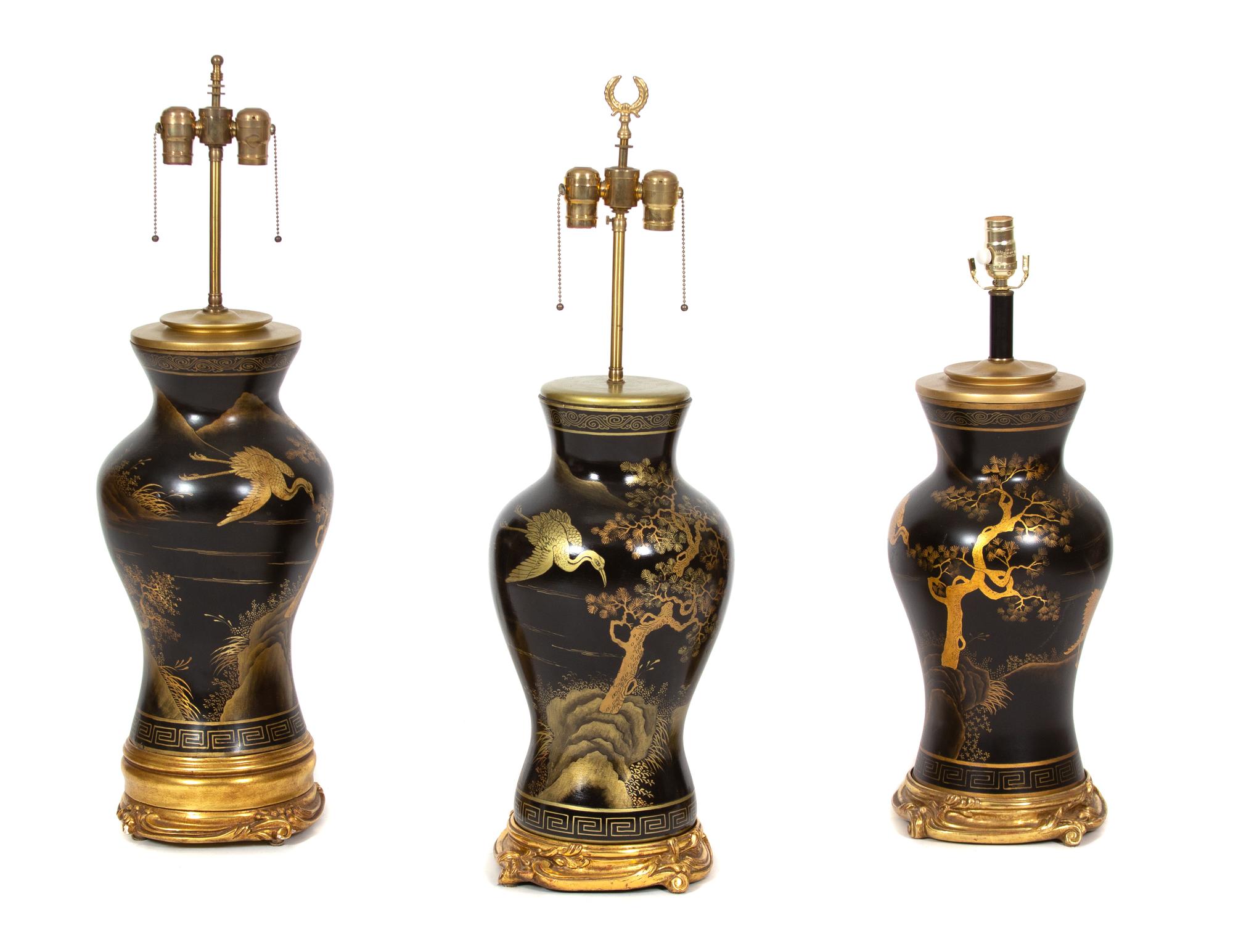 A Group of Three Ebonized and Parcel Gilt Table Lamps Height 22 inches. — 20TH CENTURY