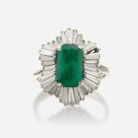 An emerald, diamond, and white gold ring