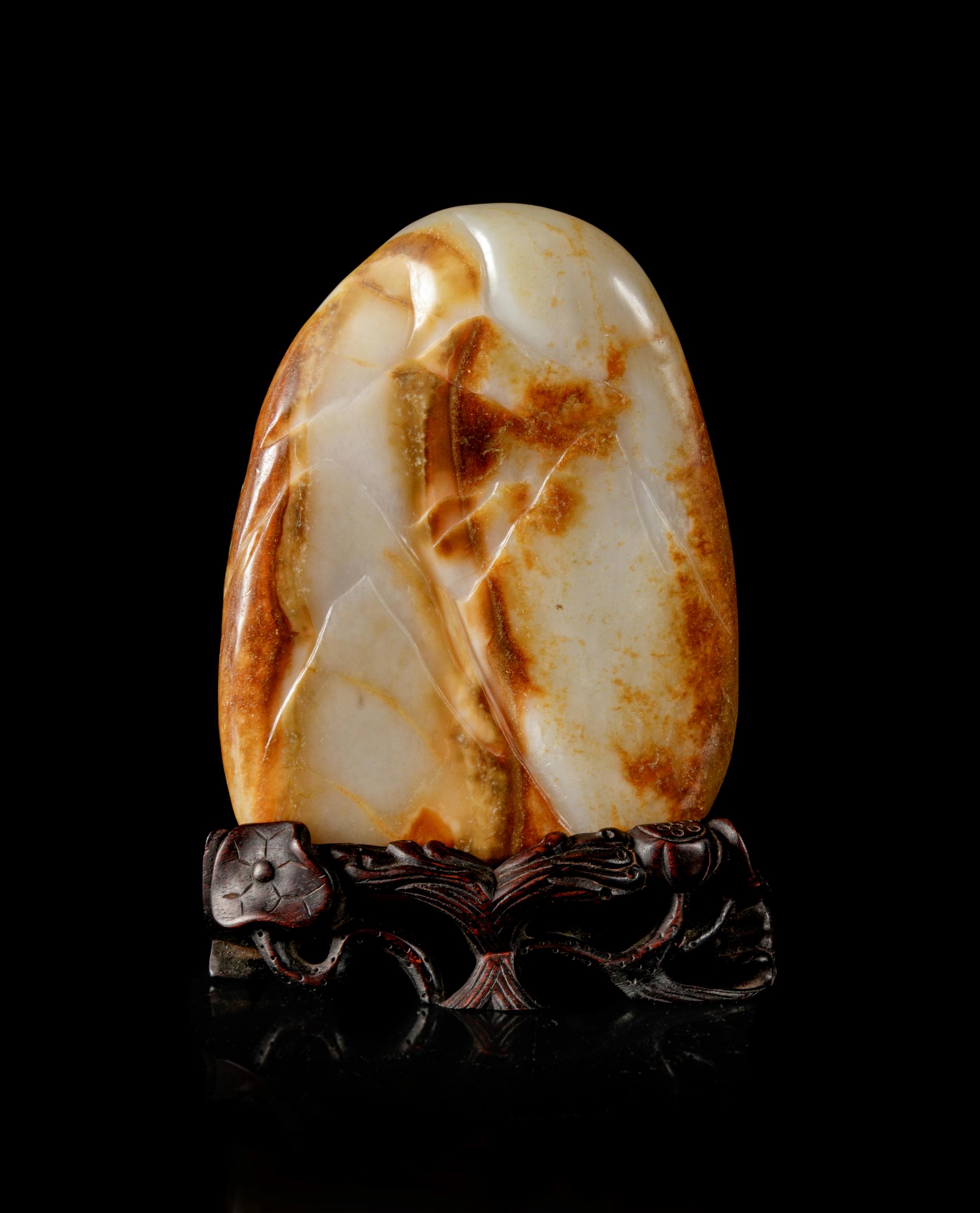 A Chinese Russet and White Jade Boulder