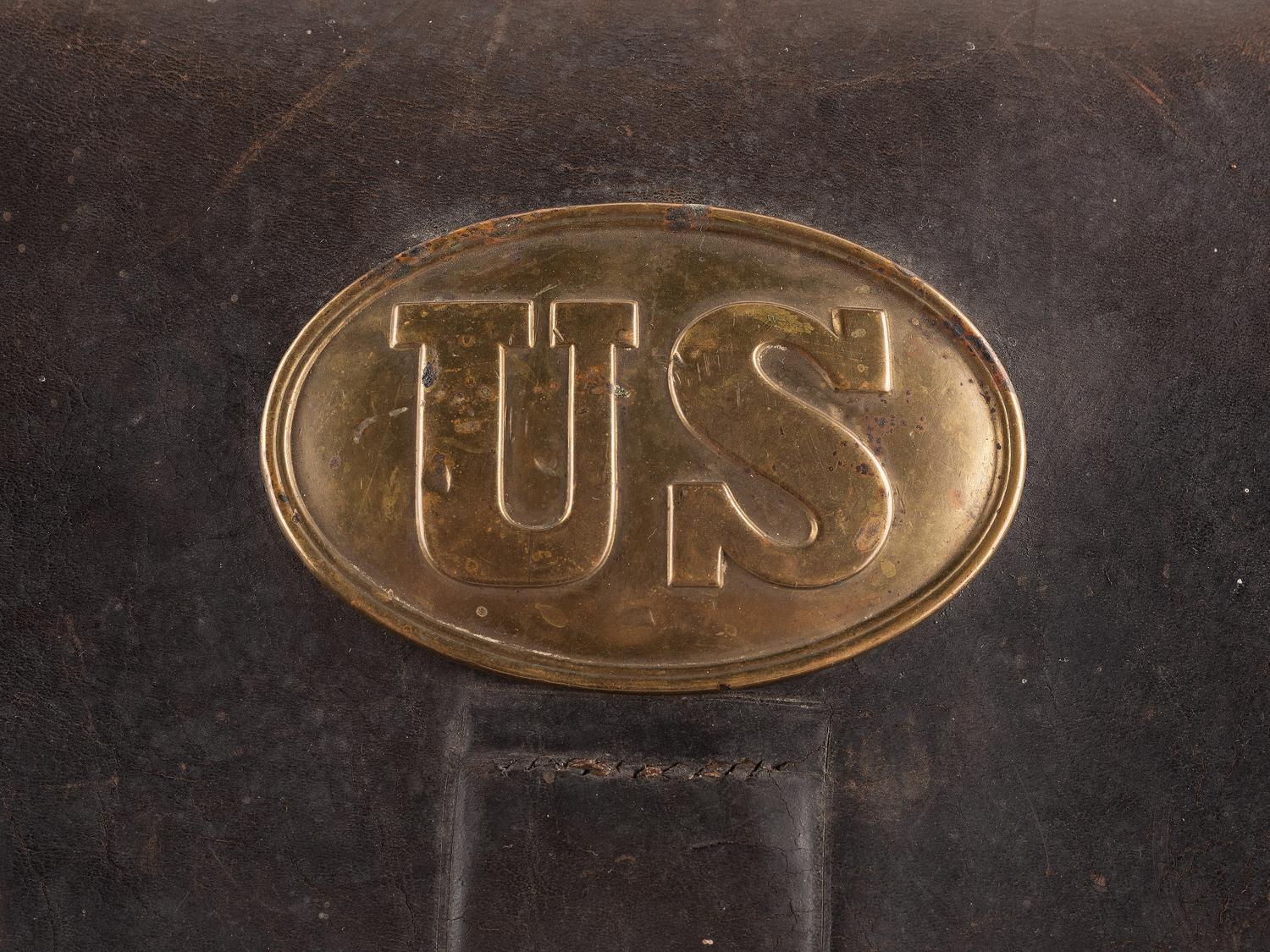 [CIVIL WAR]. A collection of items attributed to Thomas W. Johnson, Co. K, 4th Delaware Infantry, incl. frock coat, cap, belt rig, and cartridge box.