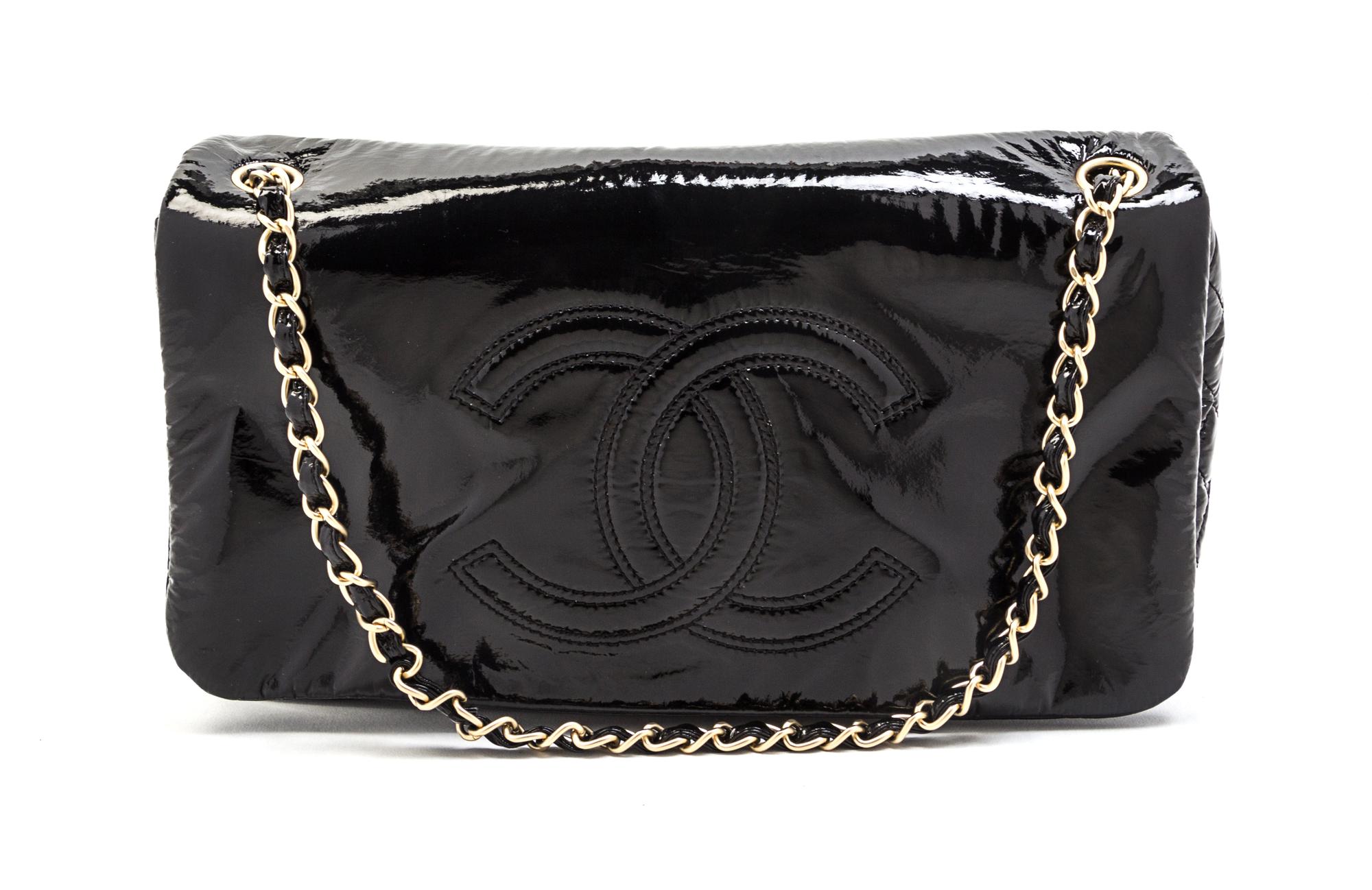 A Chanel Black Patent Vinyl Bag, 11 x 6 1/2 x 3 inches.
