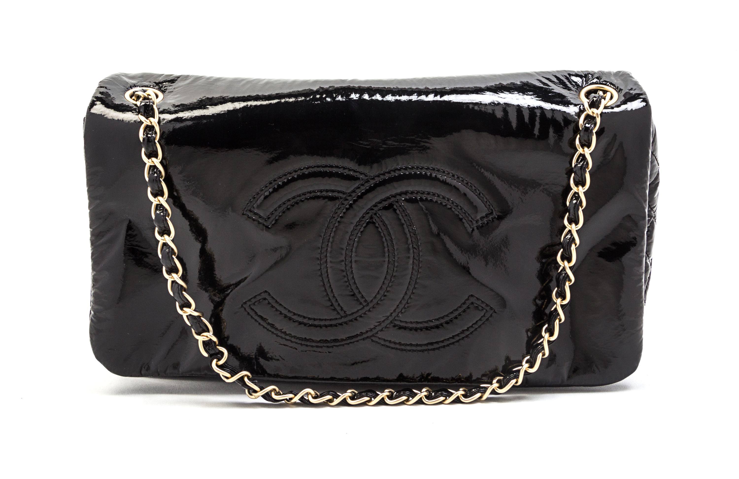 A Chanel Black Patent Vinyl Bag, 11 x 6 1/2 x 3 inches.