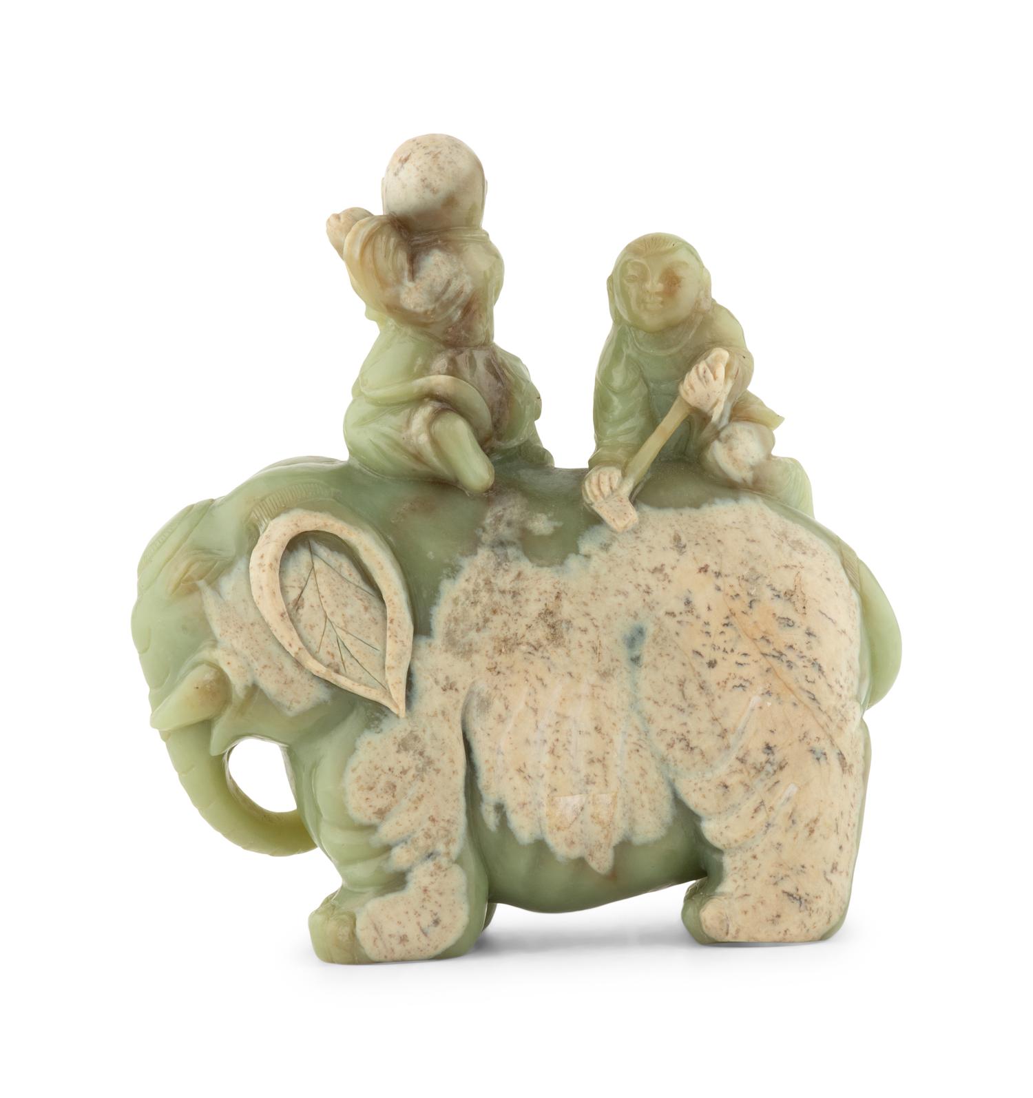 A Chinese Celadon Jade Figural Group of Boys Riding an Elephant