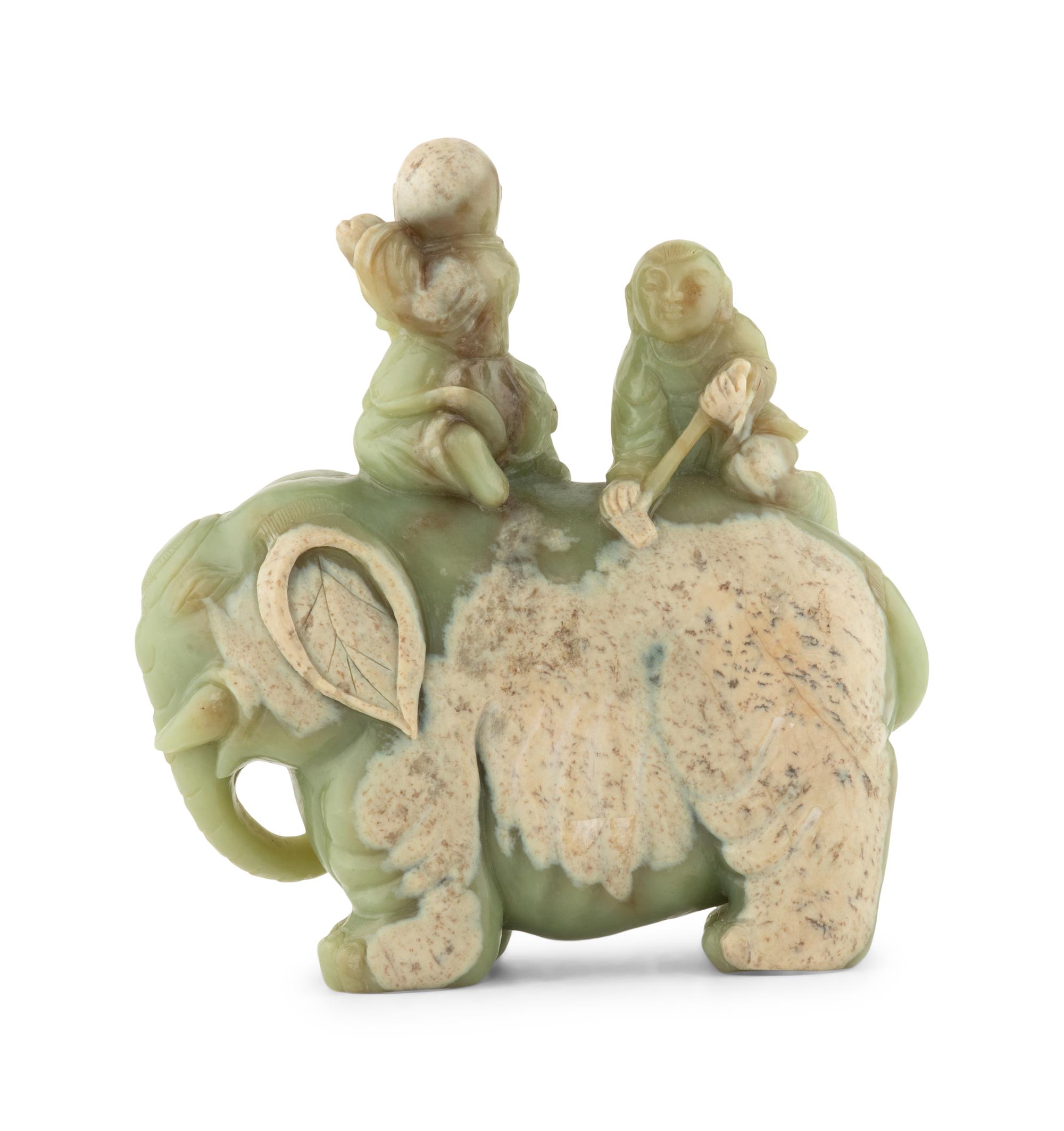 A Chinese Celadon Jade Figural Group of Boys Riding an Elephant