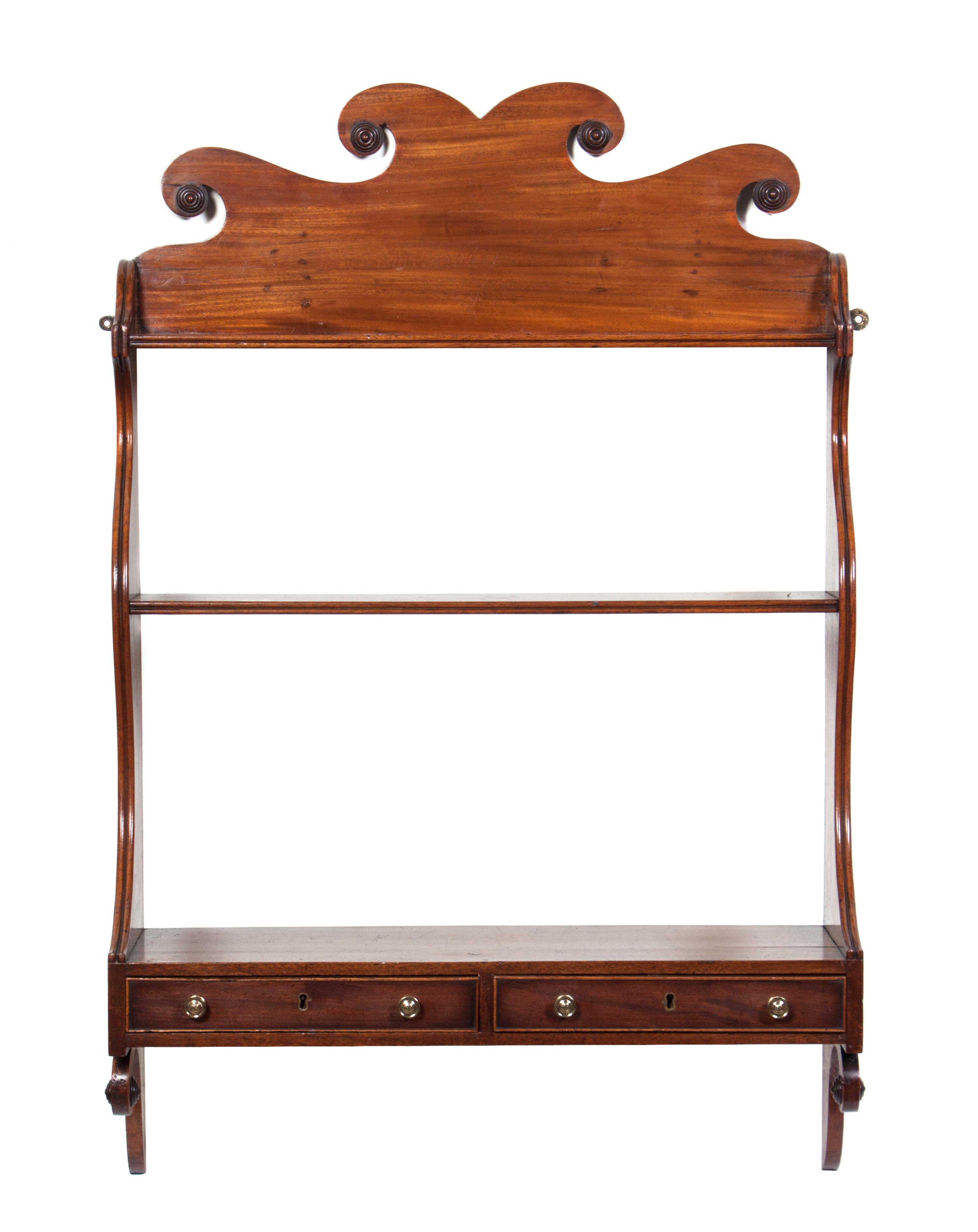 An English Mahogany Hanging Wall Shelf Height 41 inches.