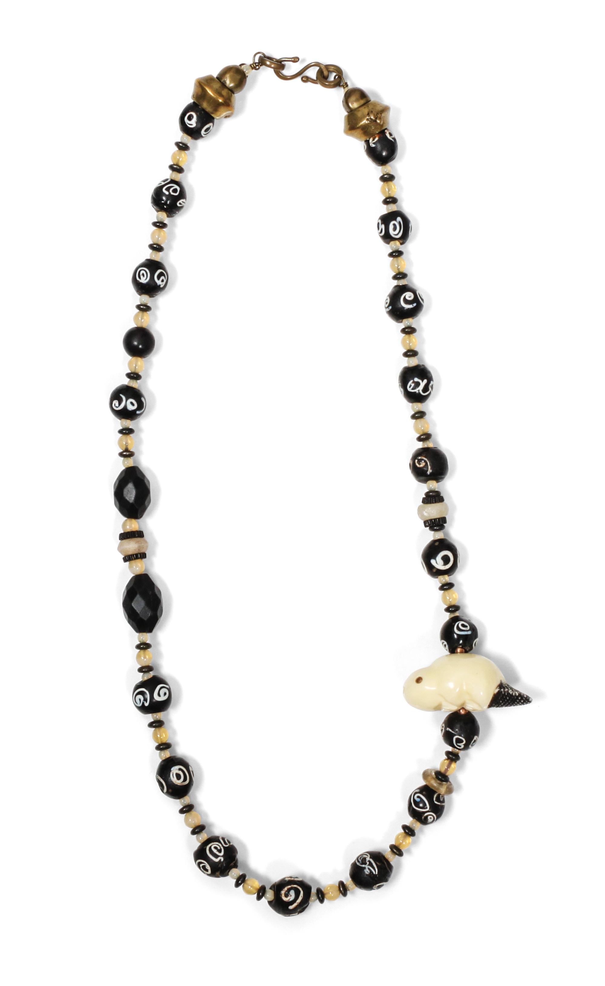 Two Single Strand Carved Fossil Fetish Necklaces, Robert Kaniatobe (1936-1998) Length of each 26 inches.