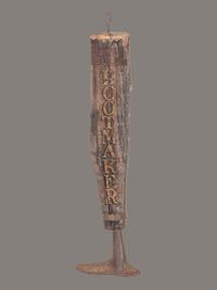 A Carved and Painted Wood and Iron Bootmaker Shop Sign