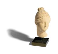 A Greek Terracotta Head of a Woman
