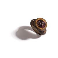 A Roman Gilt-Silver and Garnet Finger Ring with a Ram