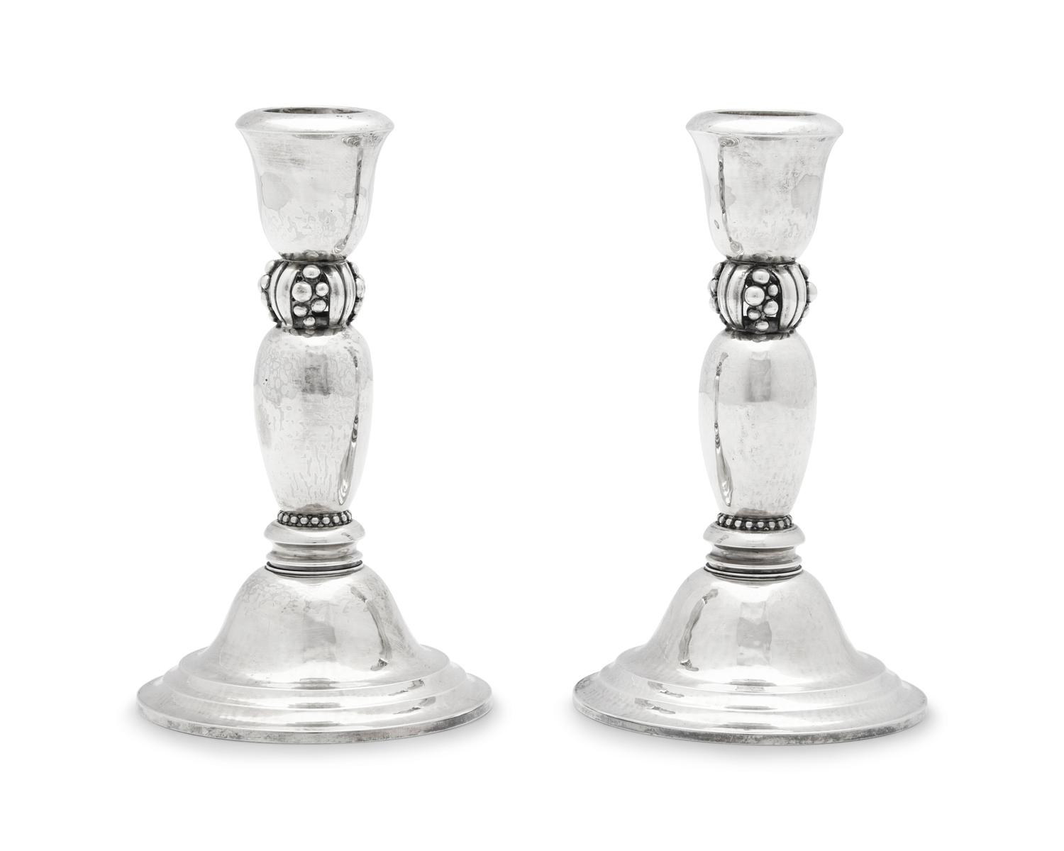 A Pair of Harald Nielsen Designed Georg Jensen Silver Candlesticks