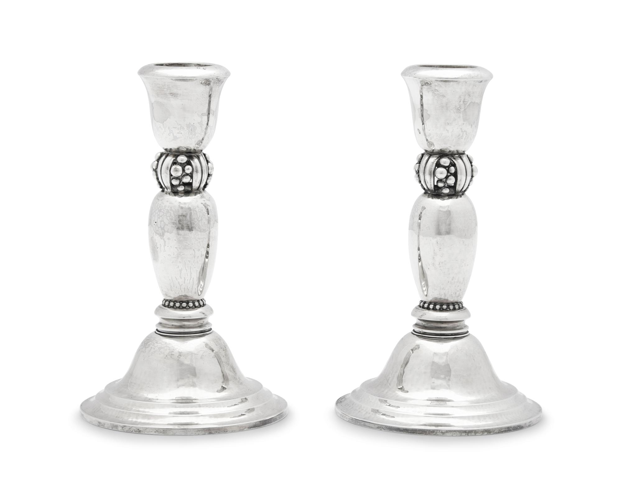 A Pair of Harald Nielsen Designed Georg Jensen Silver Candlesticks