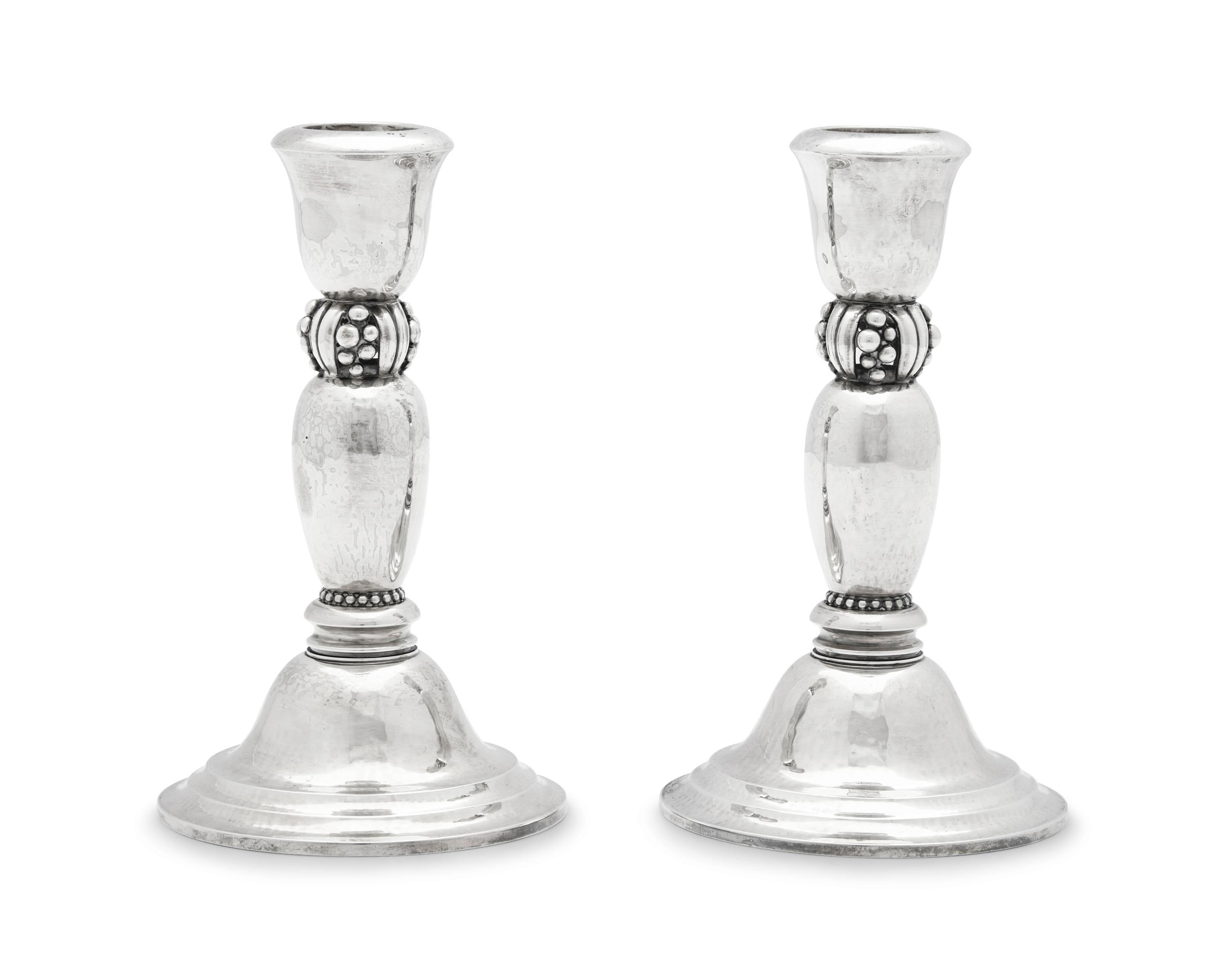 A Pair of Harald Nielsen Designed Georg Jensen Silver Candlesticks