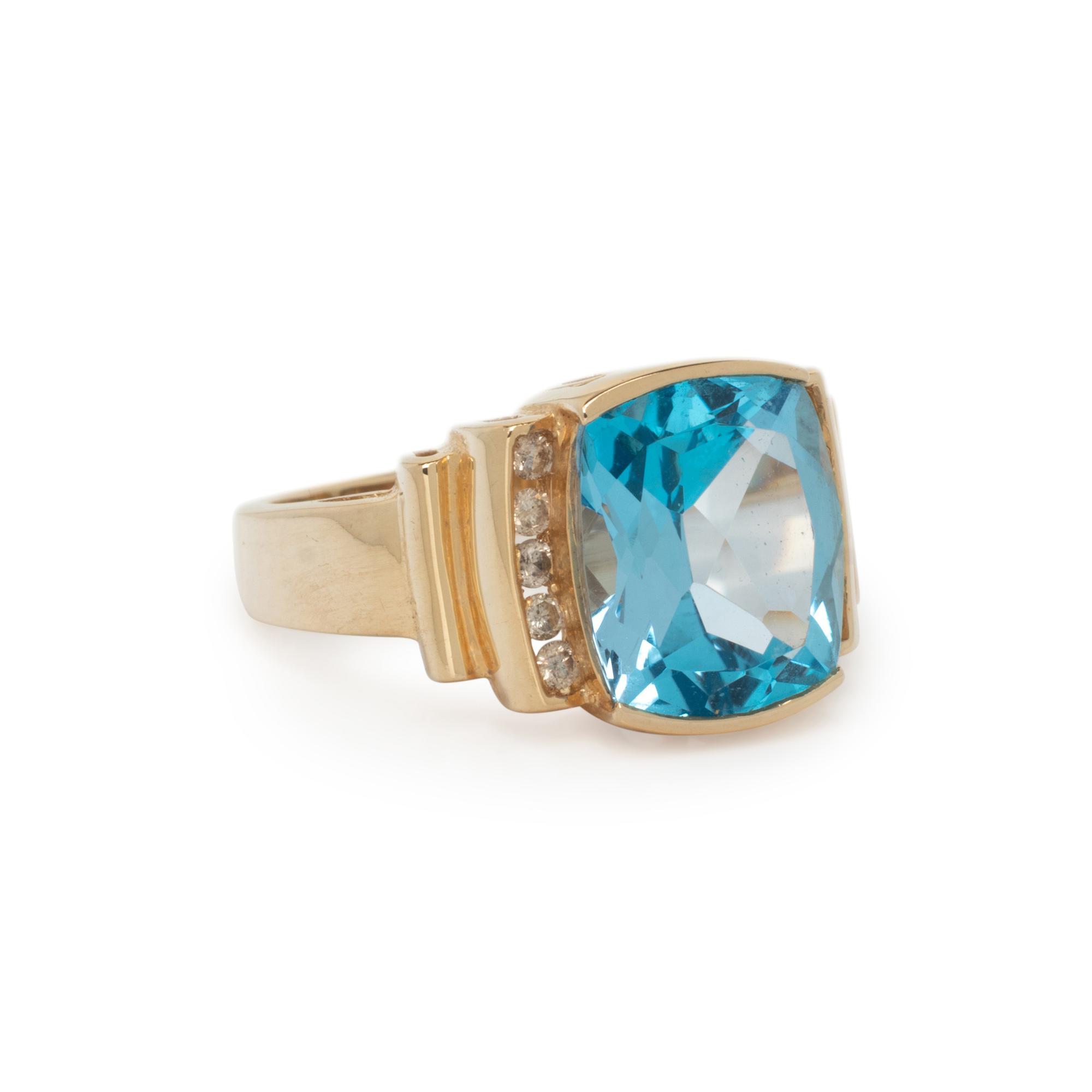 YELLOW GOLD, BLUE TOPAZ, AND DIAMOND RING