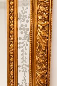 A Pair of Louis XV Style Gilt and Engraved Mirrors
