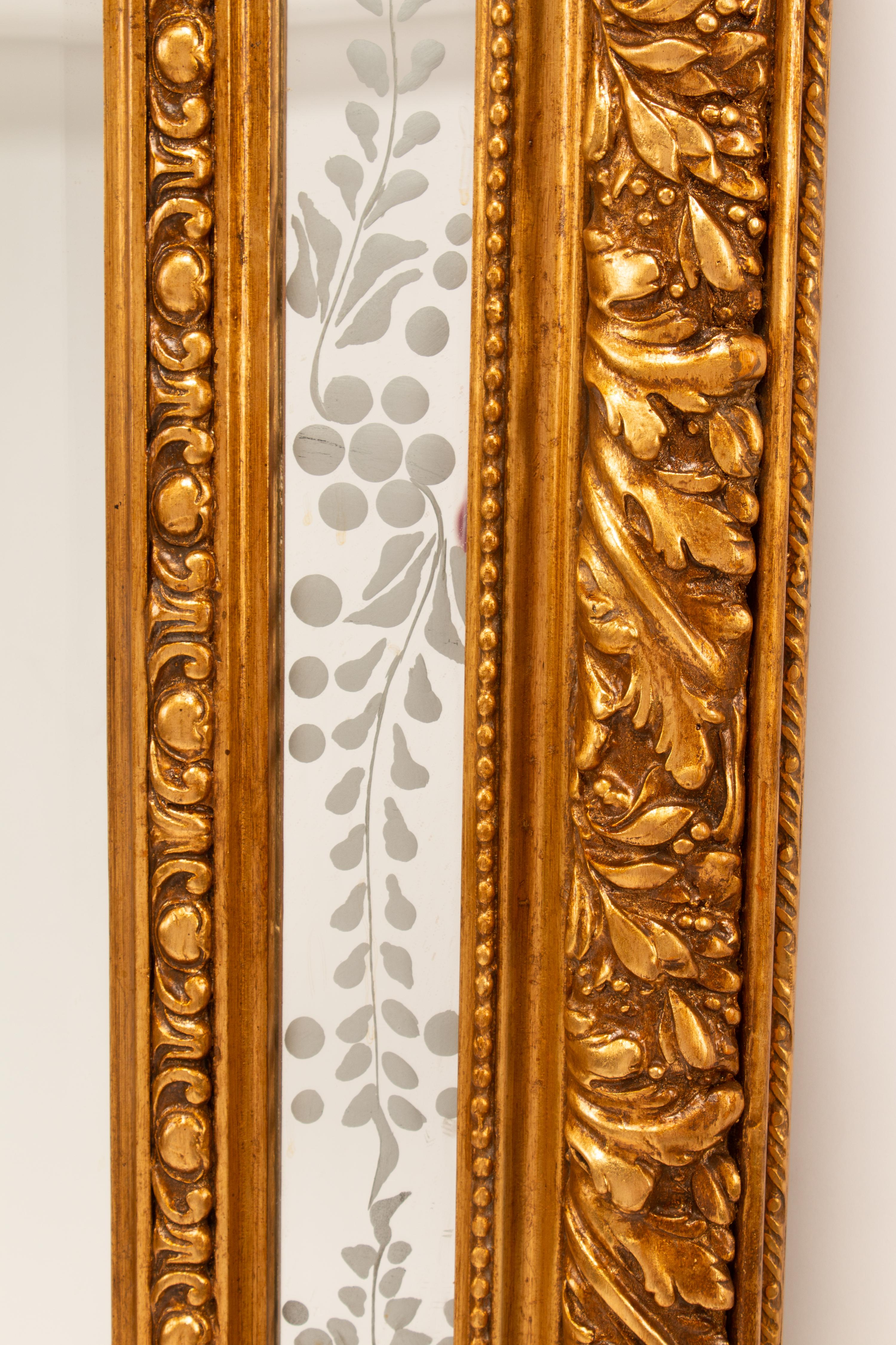 A Pair of Louis XV Style Gilt and Engraved Mirrors
