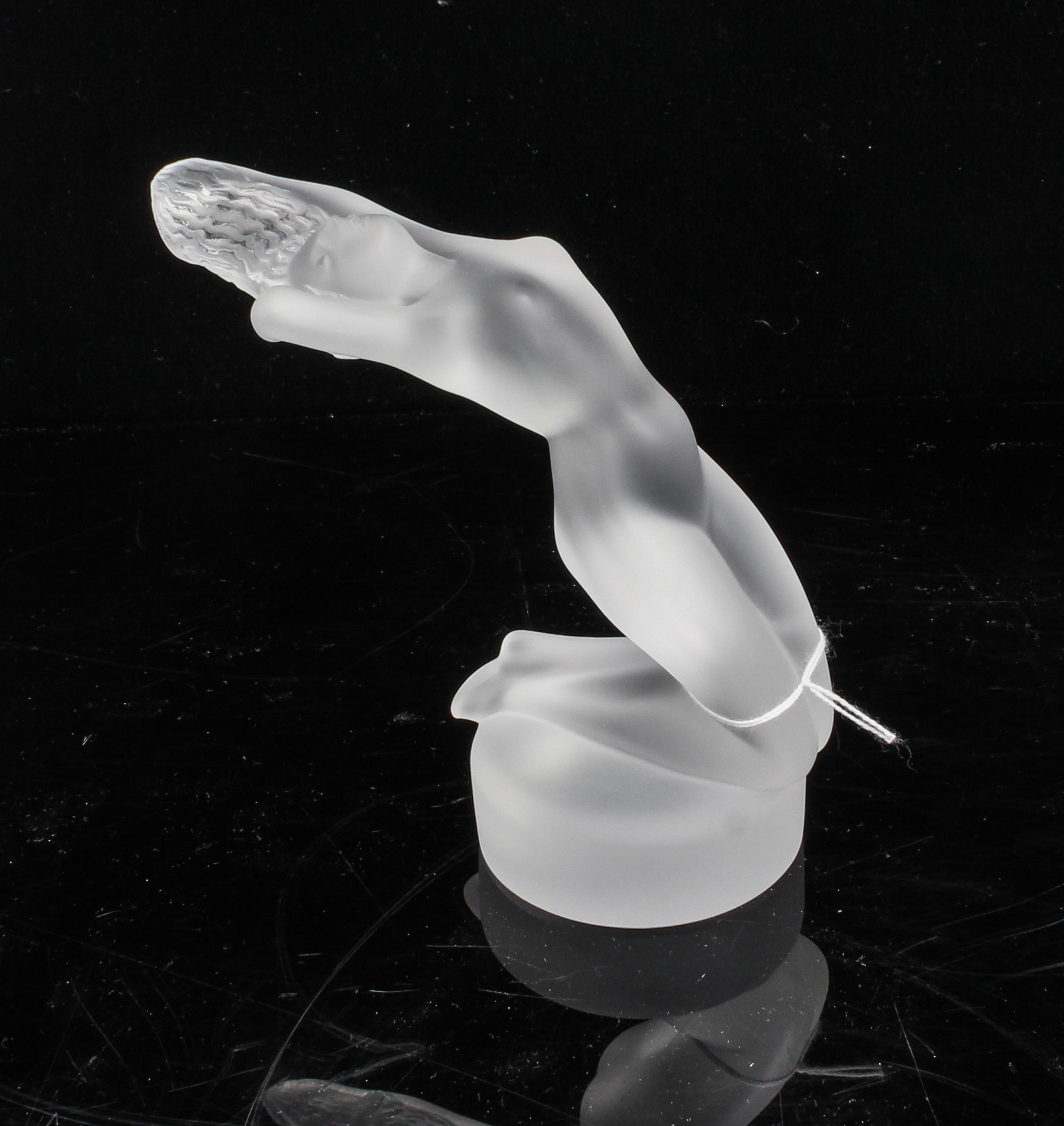 A Lalique Molded and Frosted Glass Figure Height 5 1/2 inches.