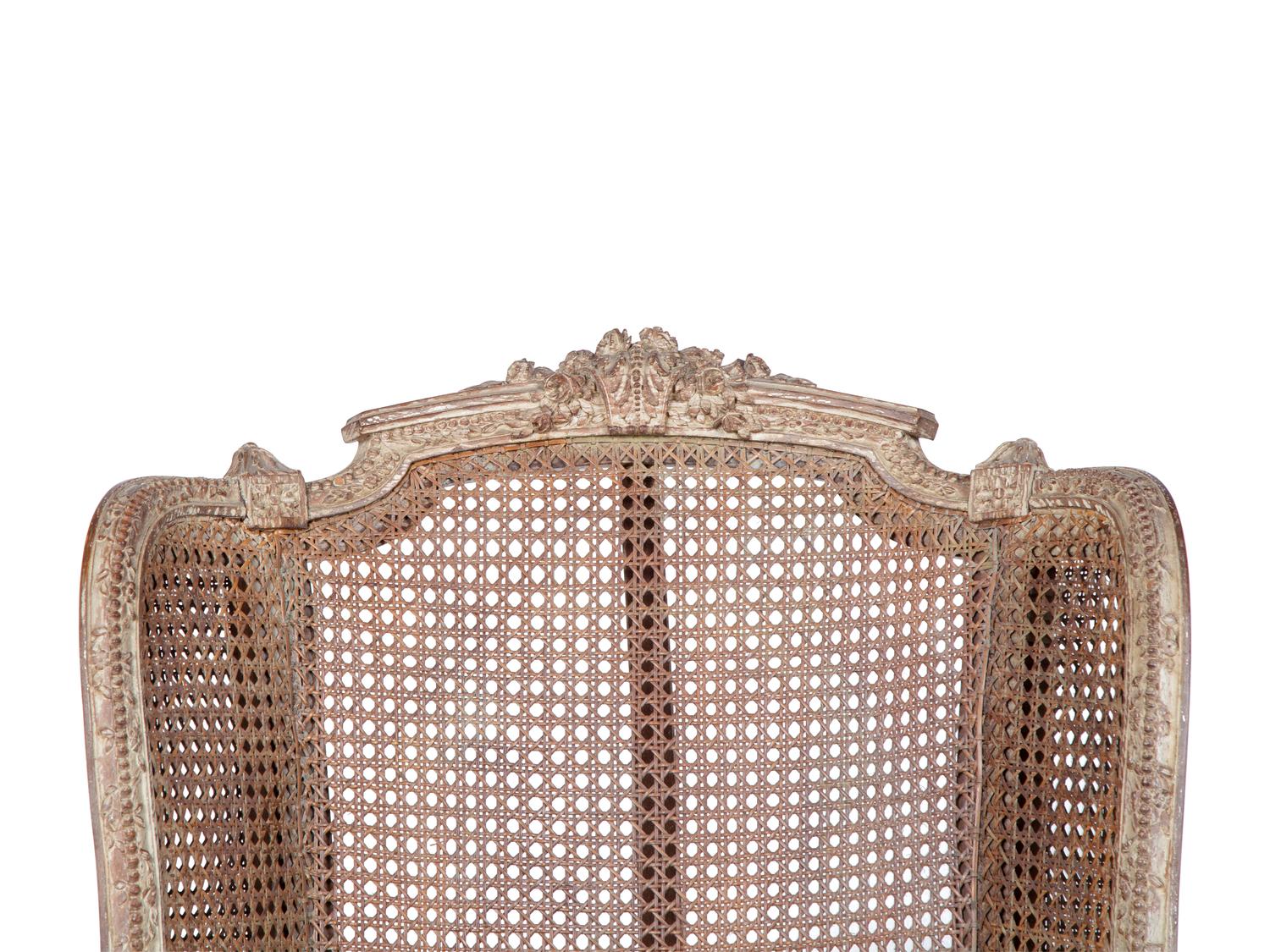 A Louis XVI Style Caned Bergere — LATE 19TH/EARLY 20TH CENTURY