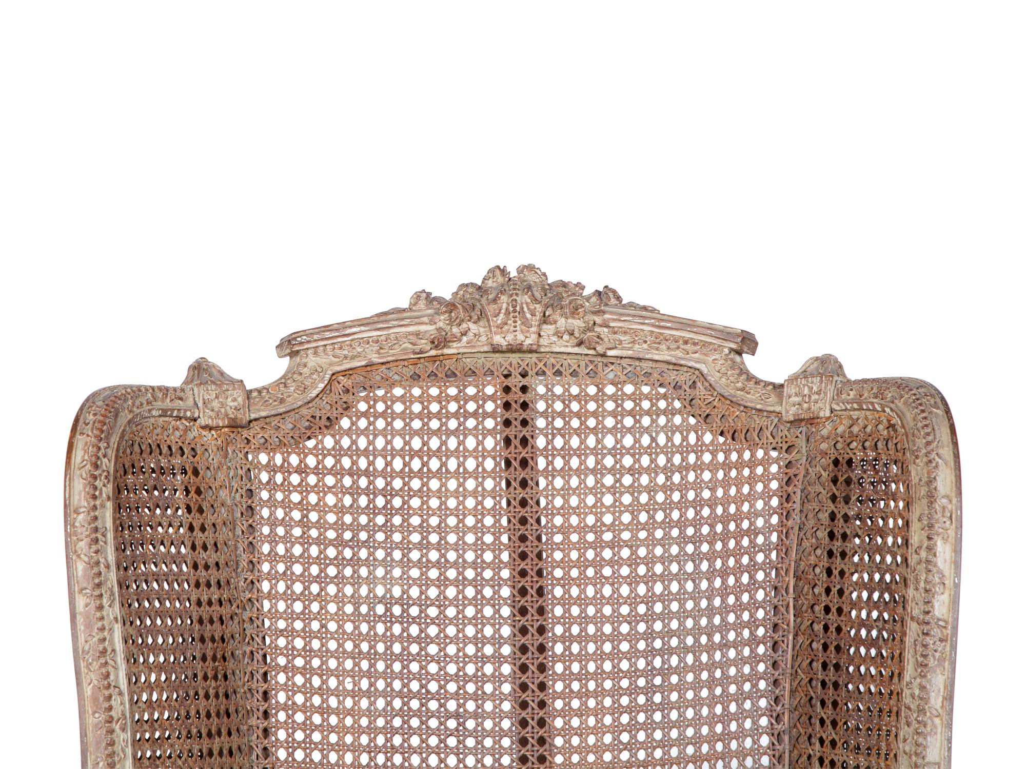 A Louis XVI Style Caned Bergere — LATE 19TH/EARLY 20TH CENTURY