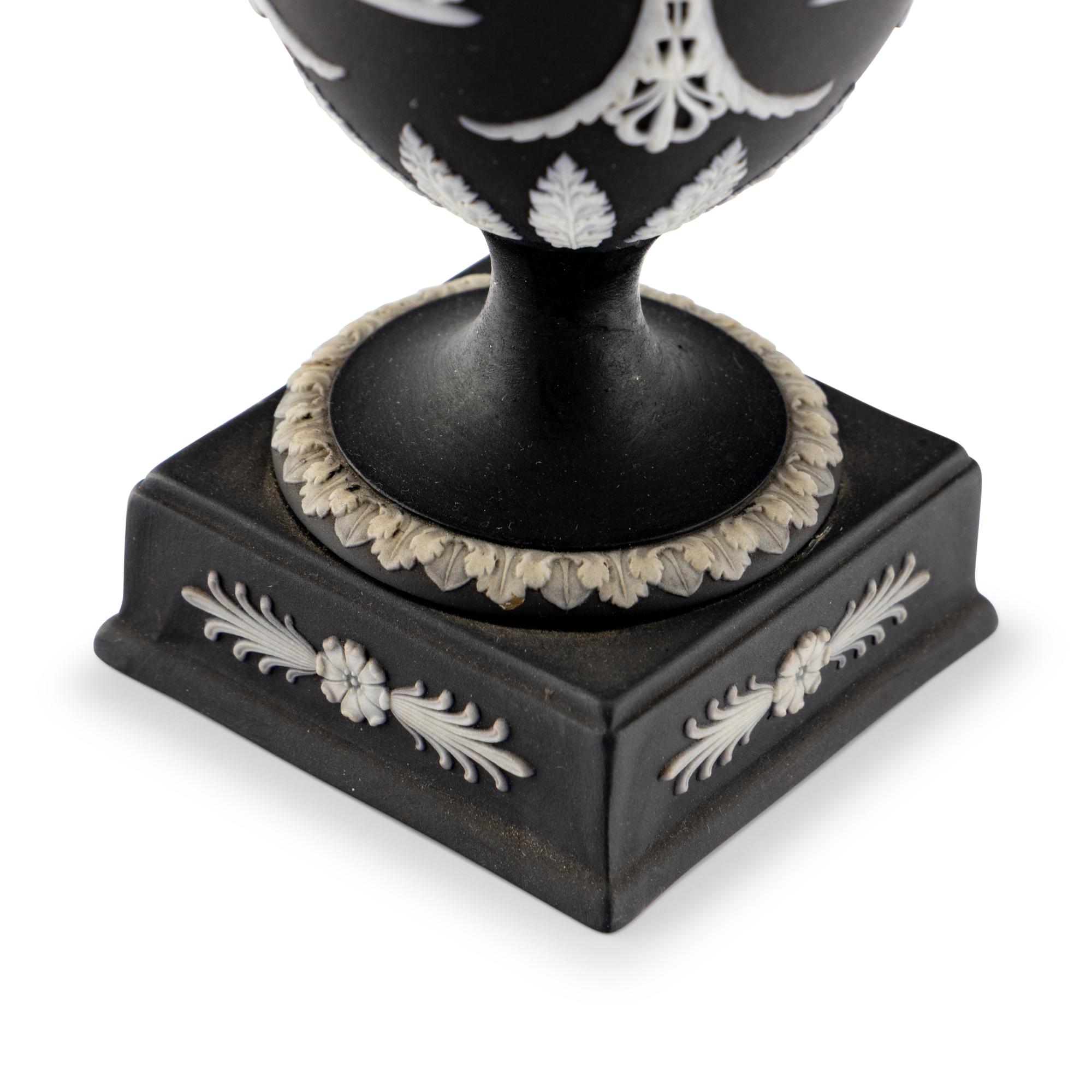A Pair of Wedgwood Black Jasperware Urns