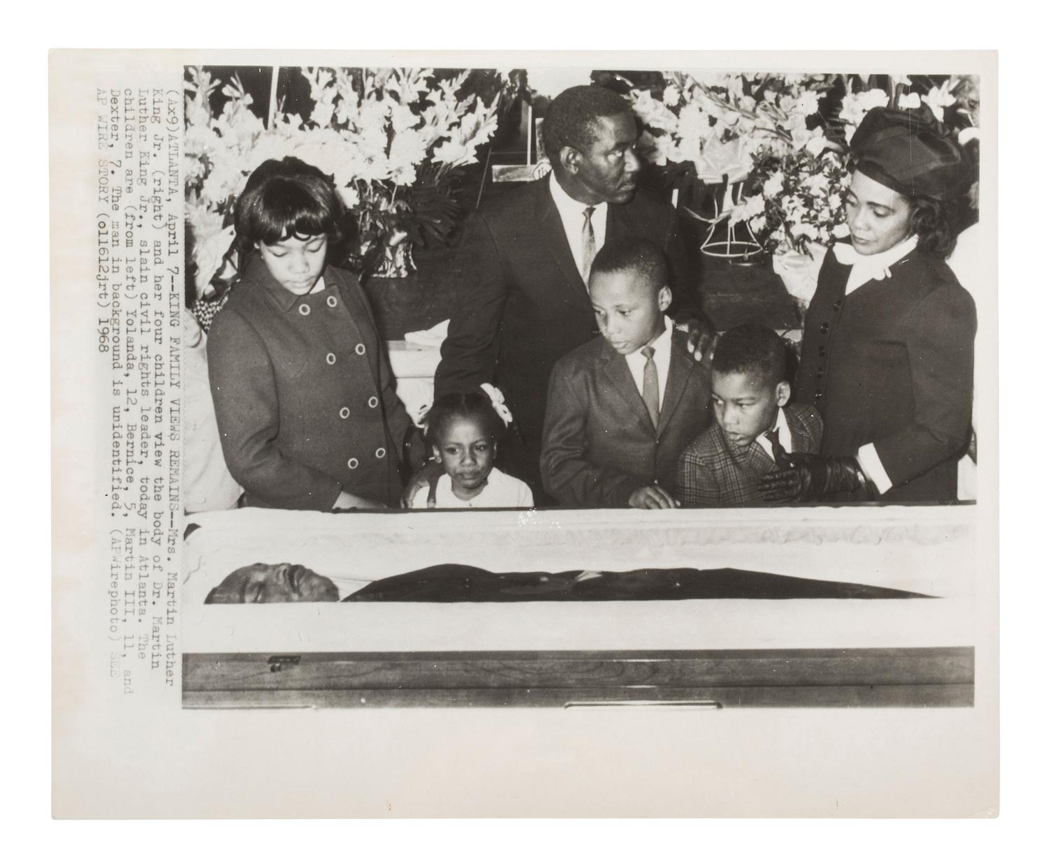 [KING, Martin Luther, Jr. (1929-1968)]. A group of 3 press photographs documenting Dr. King's funeral, incl. Coretta Scott King and her four children viewing the body of the slain civil rights leader. Atlanta, GA, 12 April 1968.