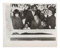 [KING, Martin Luther, Jr. (1929-1968)]. A group of 3 press photographs documenting Dr. King's funeral, incl. Coretta Scott King and her four children viewing the body of the slain civil rights leader. Atlanta, GA, 12 April 1968.