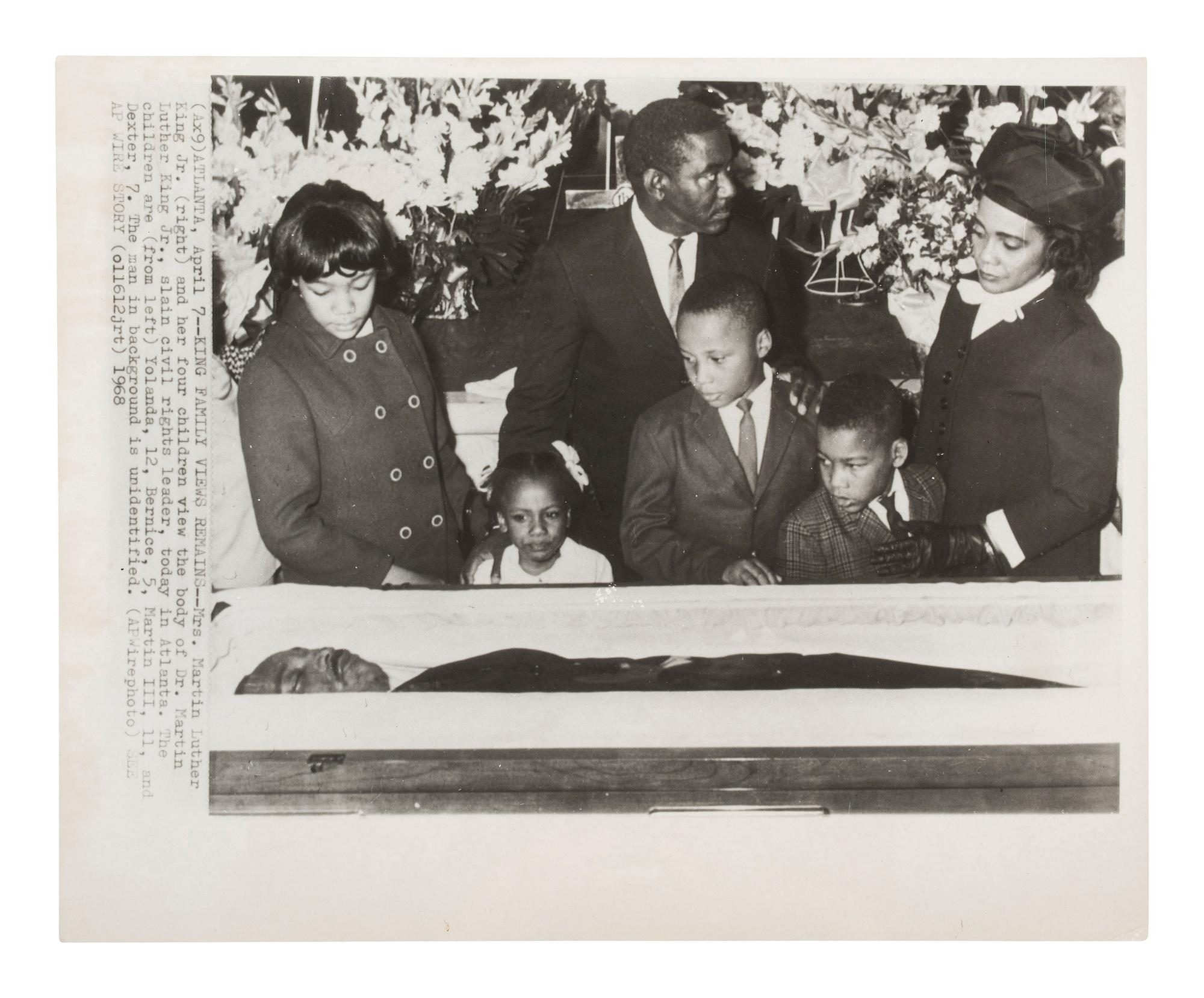[KING, Martin Luther, Jr. (1929-1968)]. A group of 3 press photographs documenting Dr. King's funeral, incl. Coretta Scott King and her four children viewing the body of the slain civil rights leader. Atlanta, GA, 12 April 1968.