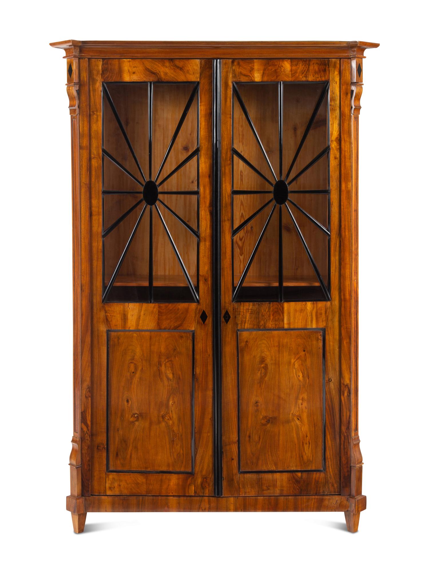 A Biedermeier Part-Ebonized Figured Walnut Bookcase