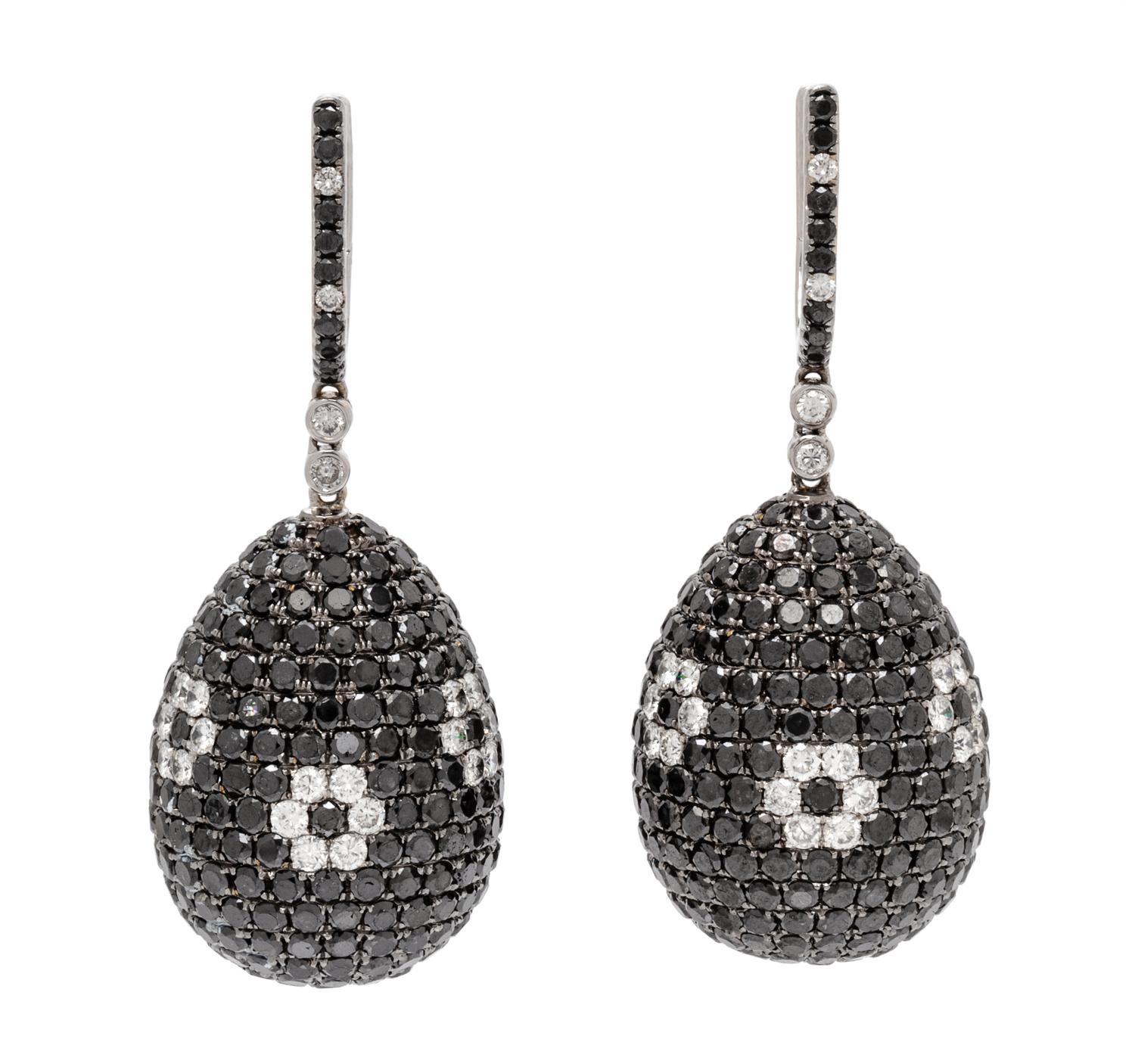 A Pair of 18 Karat White Gold, Diamond and Black Diamond Drop Earrings, 20.30 dwts.
