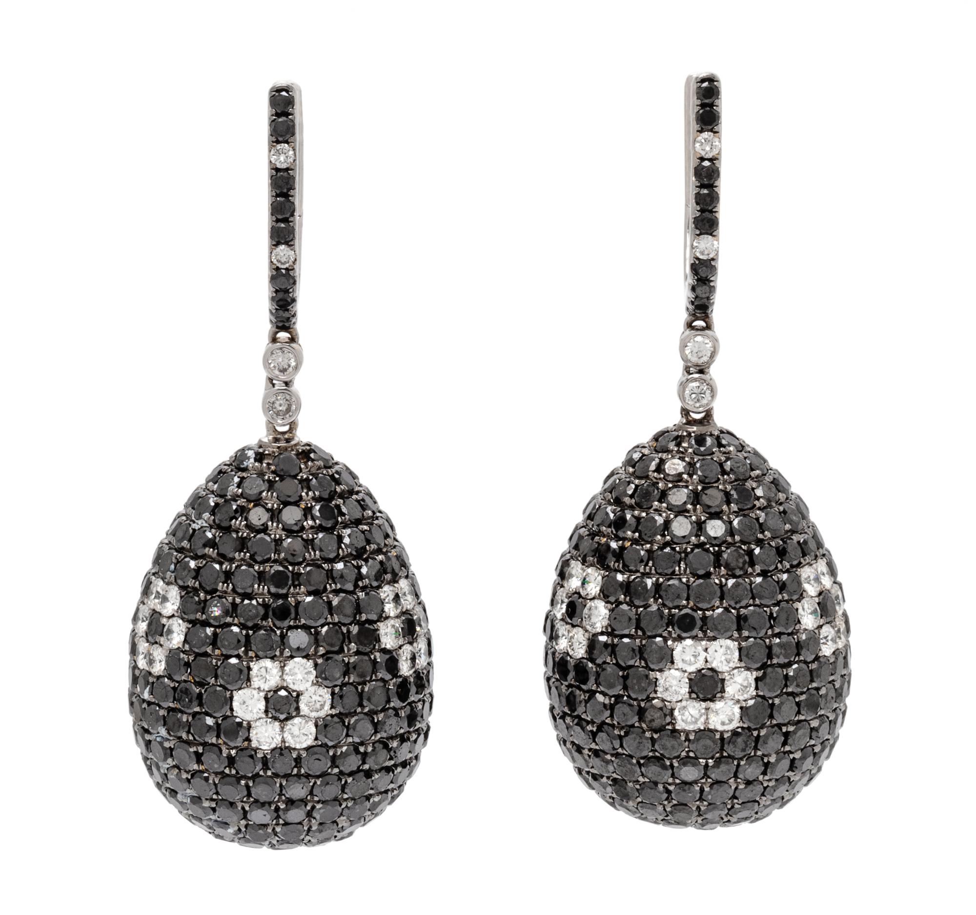 A Pair of 18 Karat White Gold, Diamond and Black Diamond Drop Earrings, 20.30 dwts.